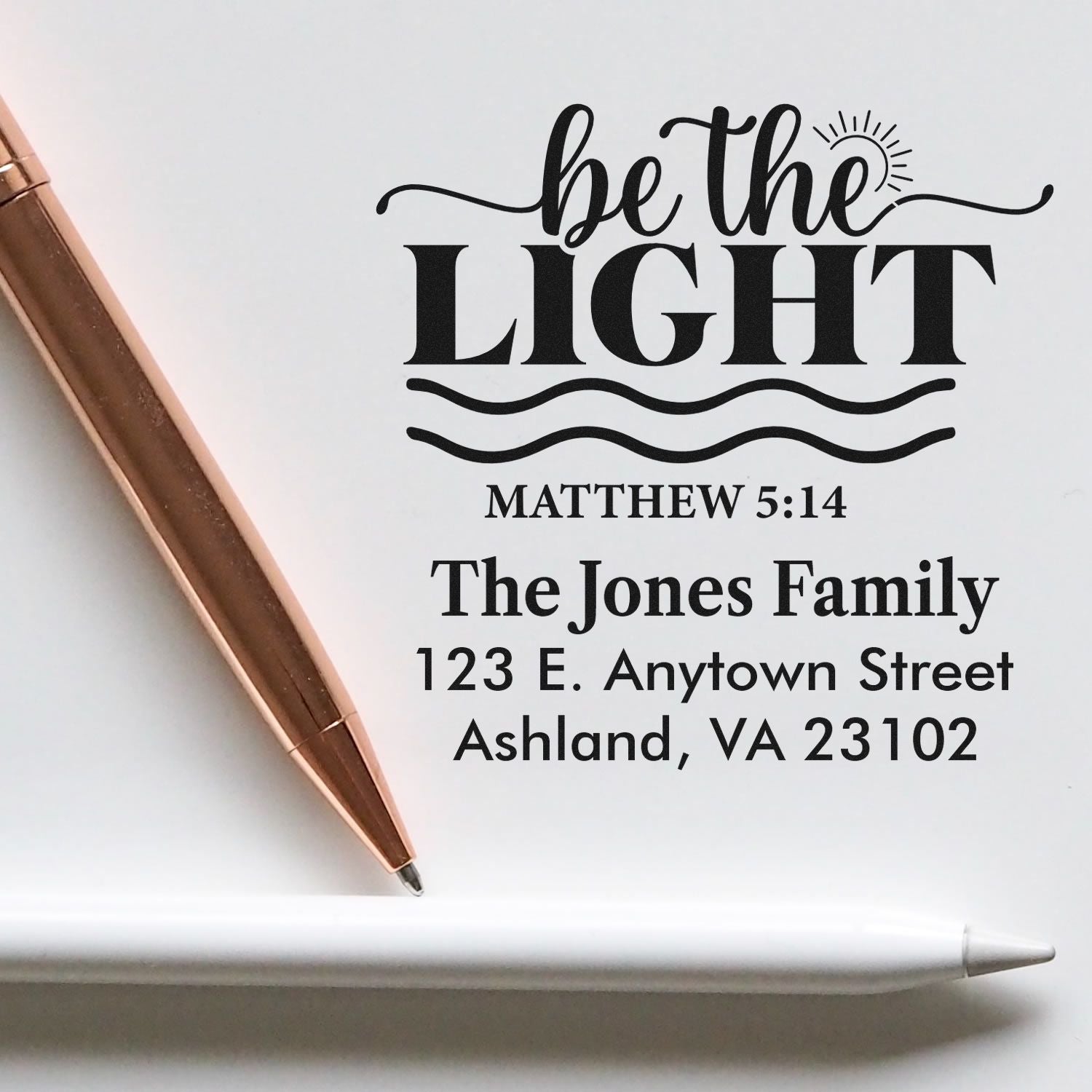 Custom return address rubber stamp with Be the Light Matthew 5:14, personalized family name and address for faith-based mail.