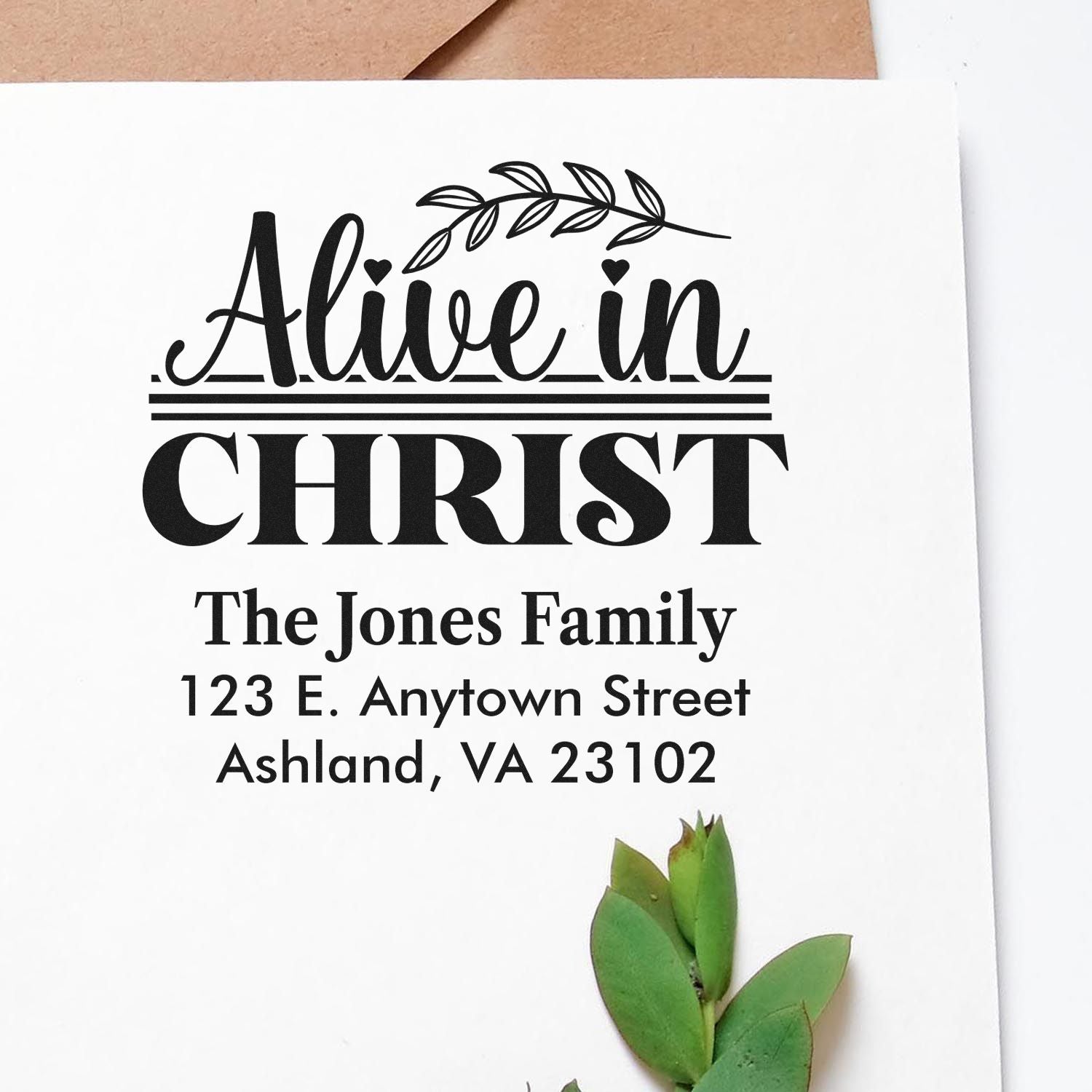 Custom Alive in Christ Christian address rubber stamp with family name and mailing address for personalized stationery.