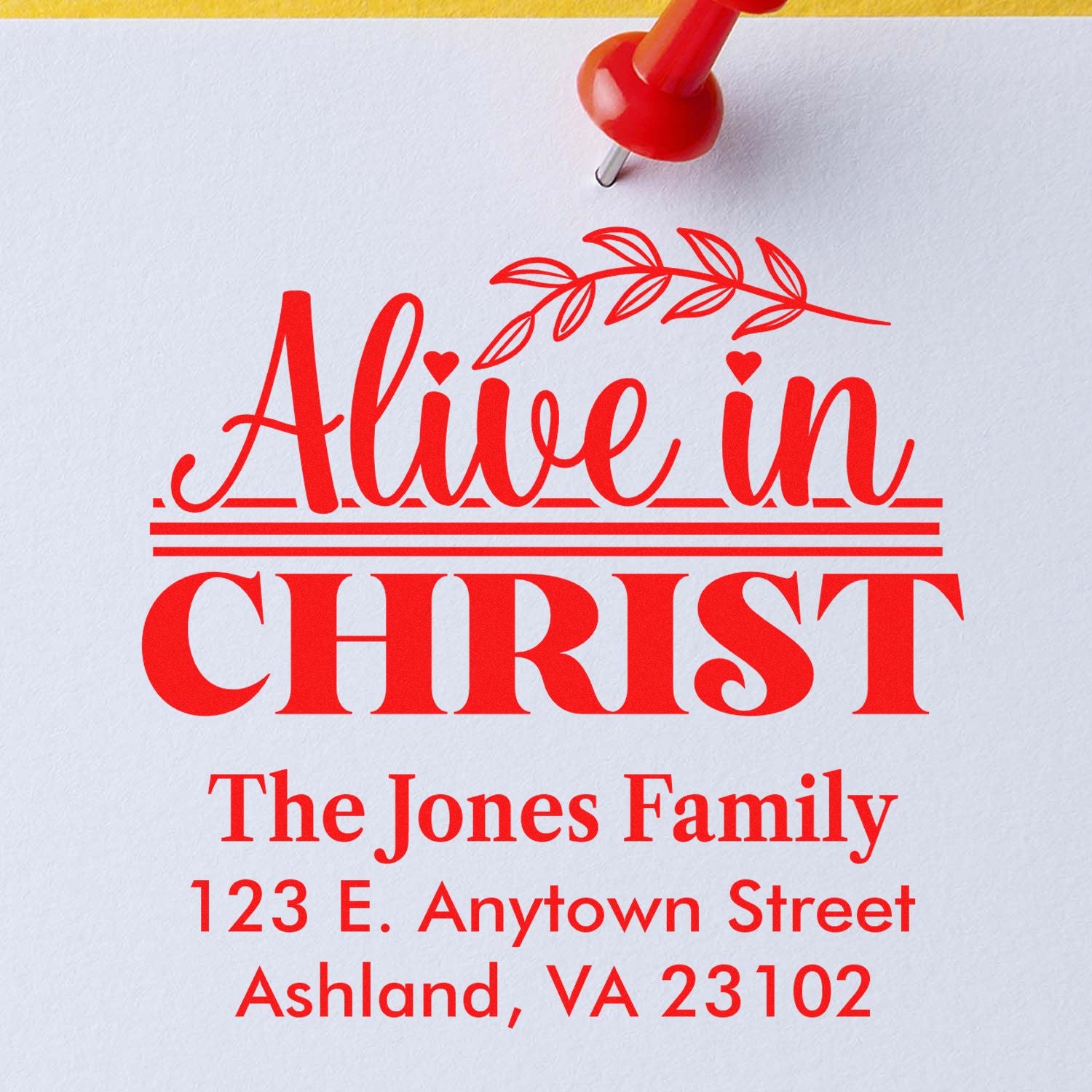 Custom Christian address rubber stamp with Alive in Christ design and The Jones Family return address.