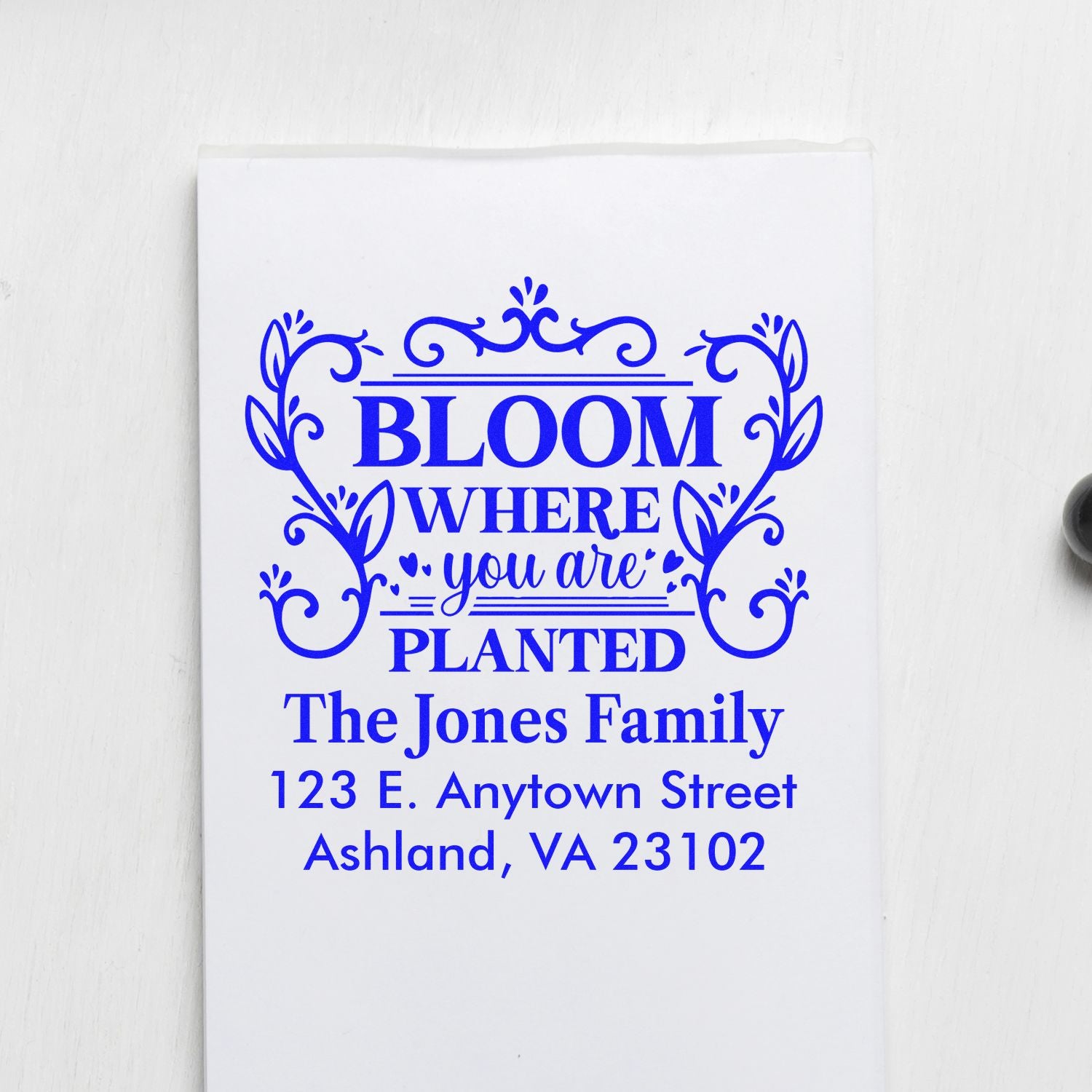Custom floral rubber address stamp with Bloom Where You Are Planted quote for personalized family stationery.