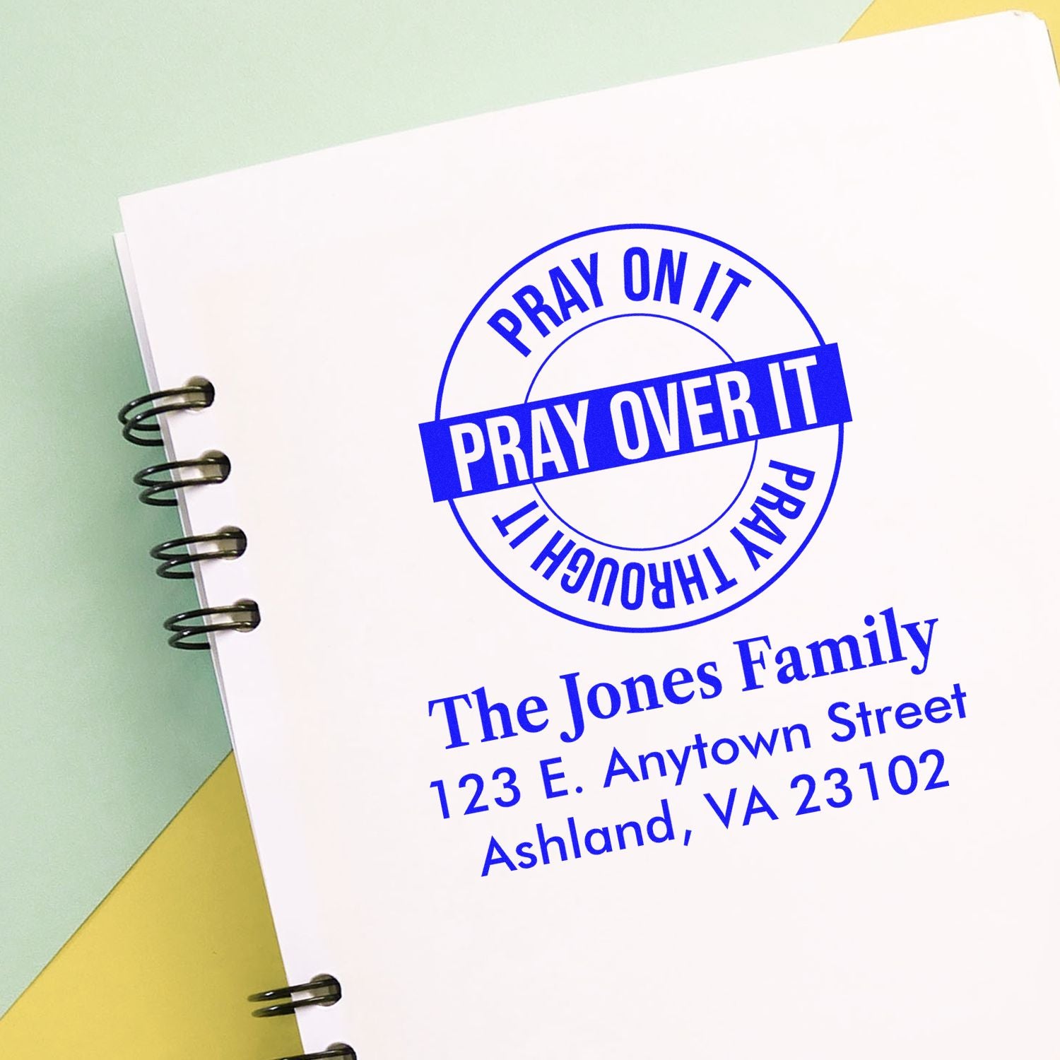 Custom rubber stamp with Pray Over It design, personalized with family name and address for faith-based stationery.