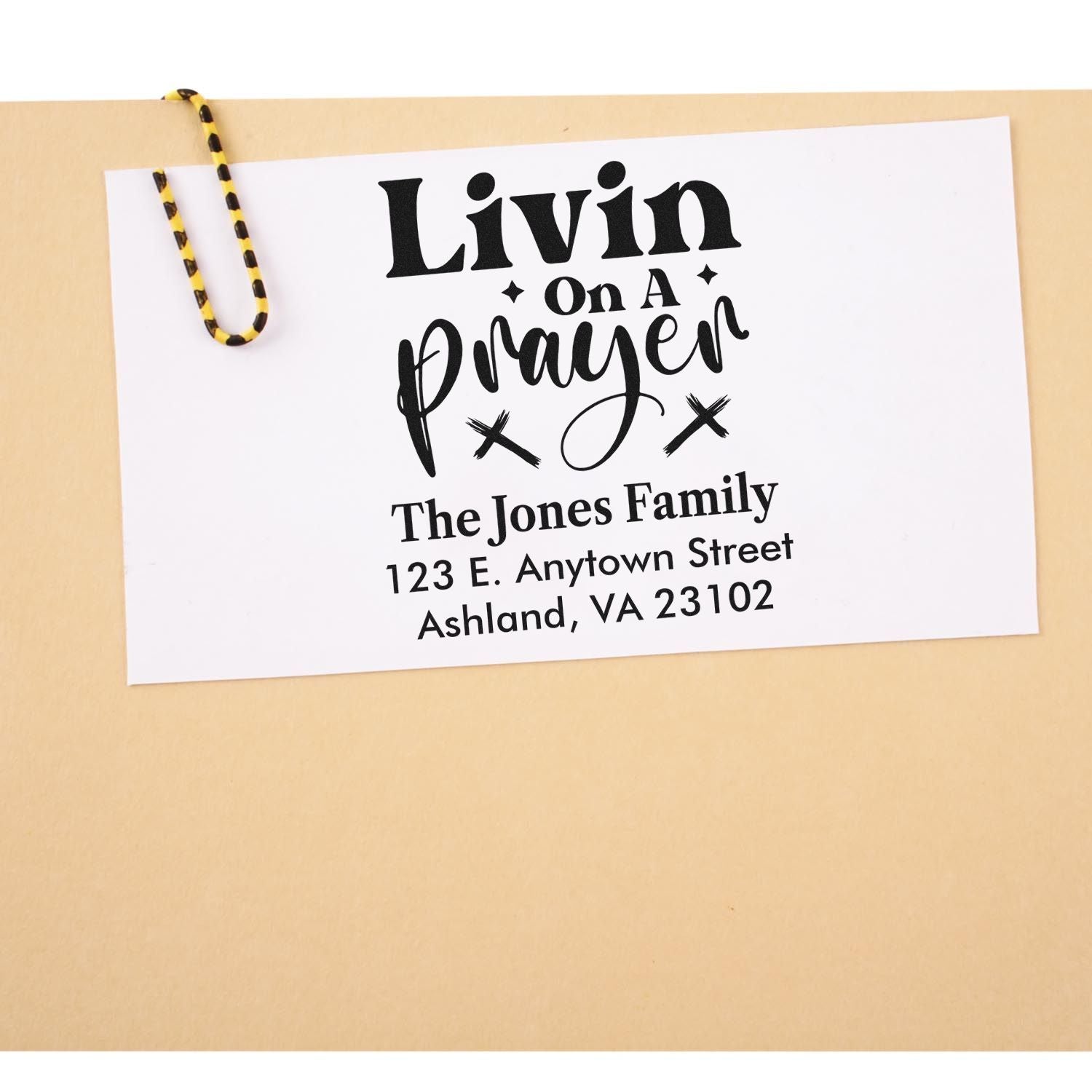 Custom rubber stamp for envelopes with Livin on a Prayer and The Jones Family return address.