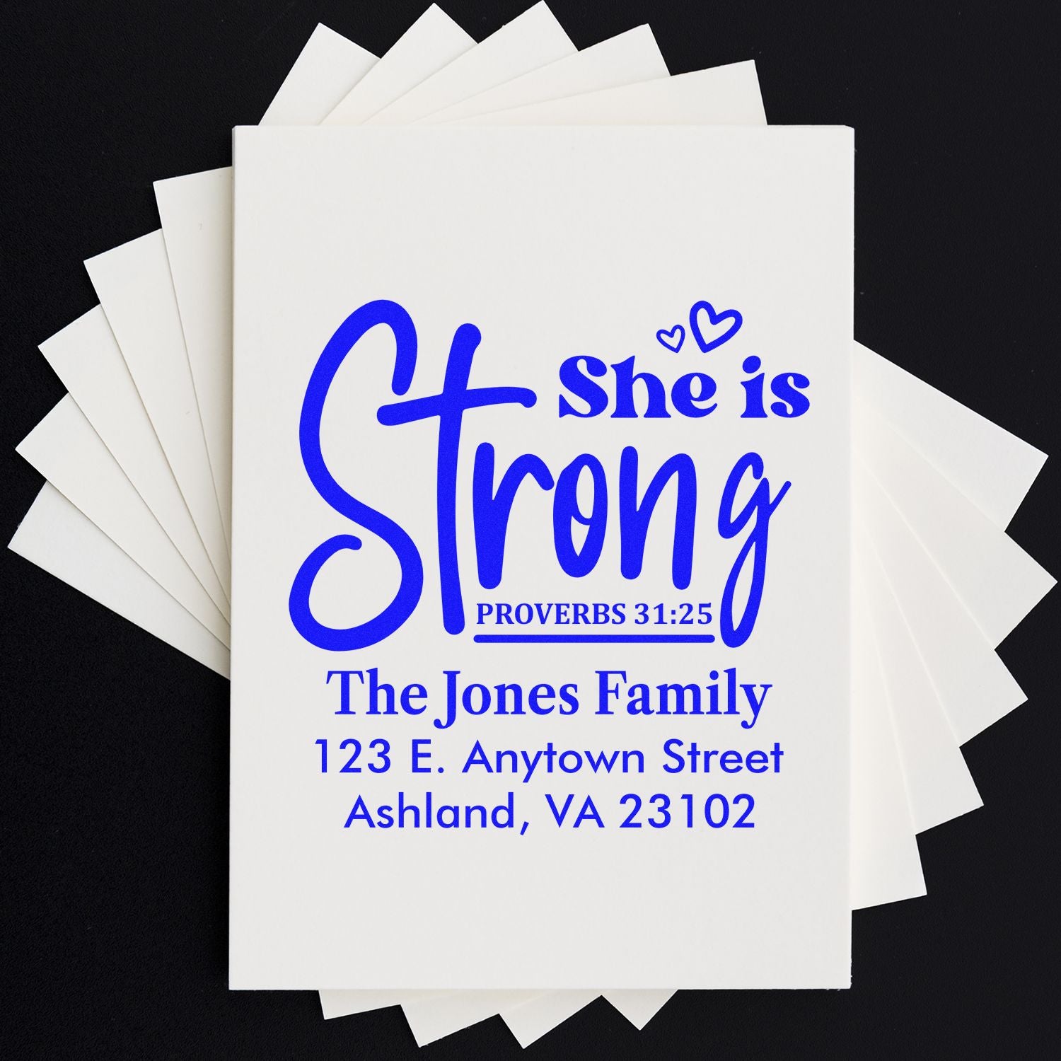 Custom Christian address stamp with She is Strong Proverbs 31:25 and family return address.