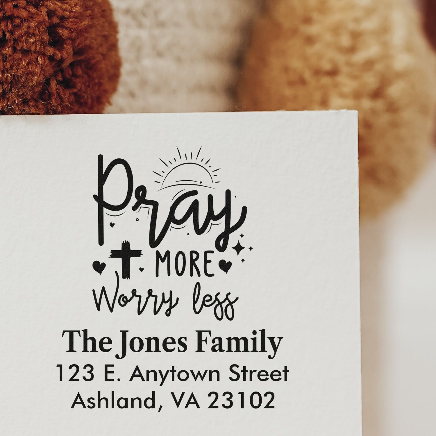 Custom rubber address stamp reading Pray More Worry Less for The Jones Family, perfect for envelopes, cards, and mail.
