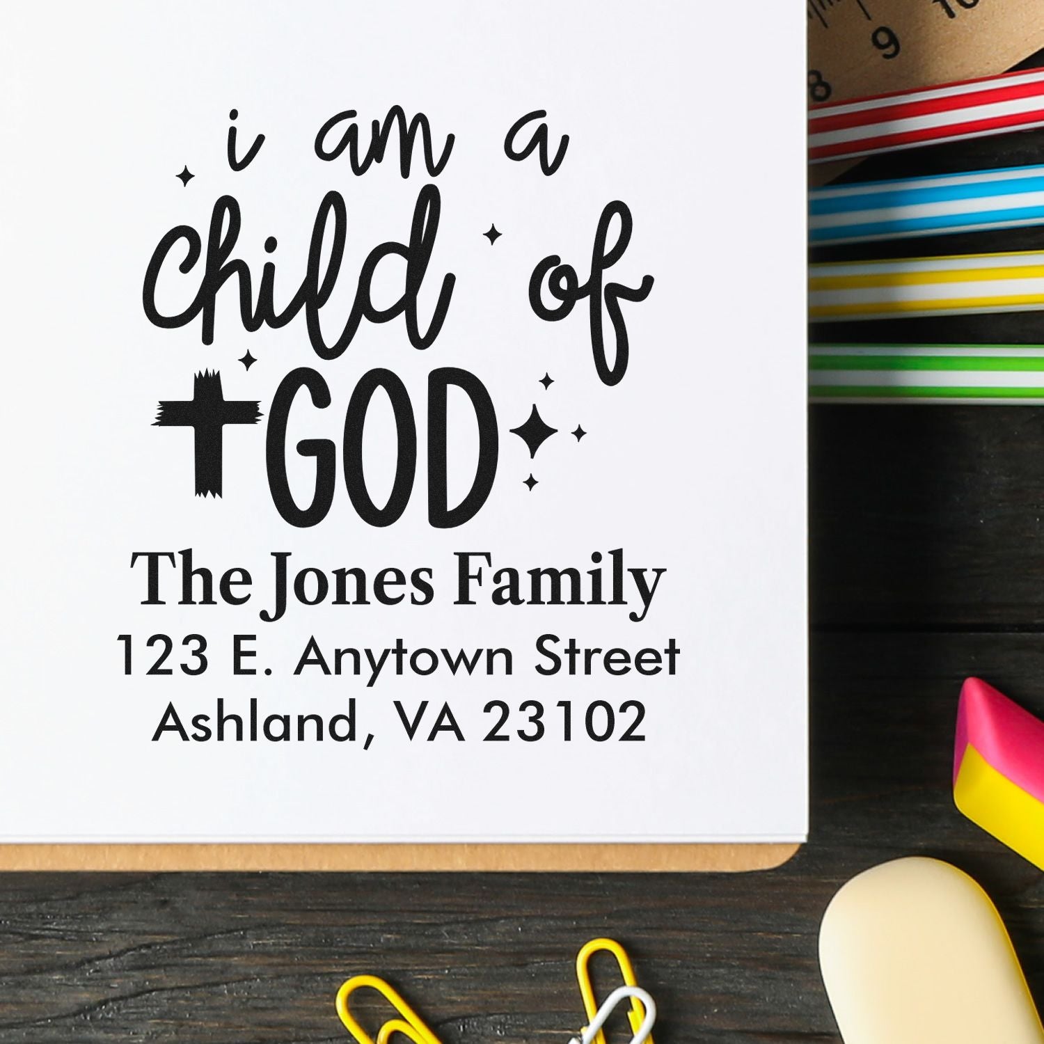 Custom rubber stamp design reading I am a child of God with The Jones Family return address.