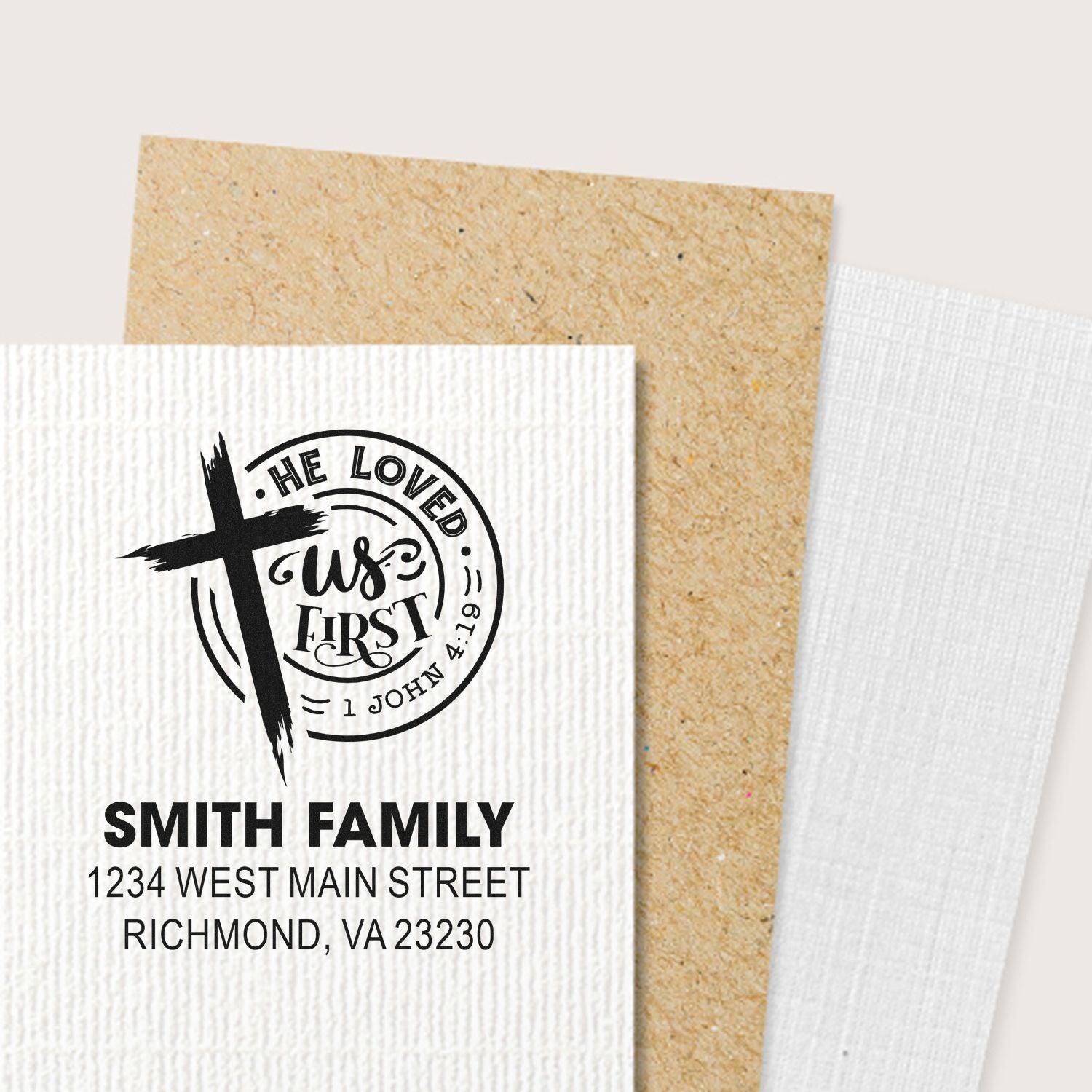 Custom Christian return address rubber stamp with cross, 1 John 4:19 verse, and Smith family address.