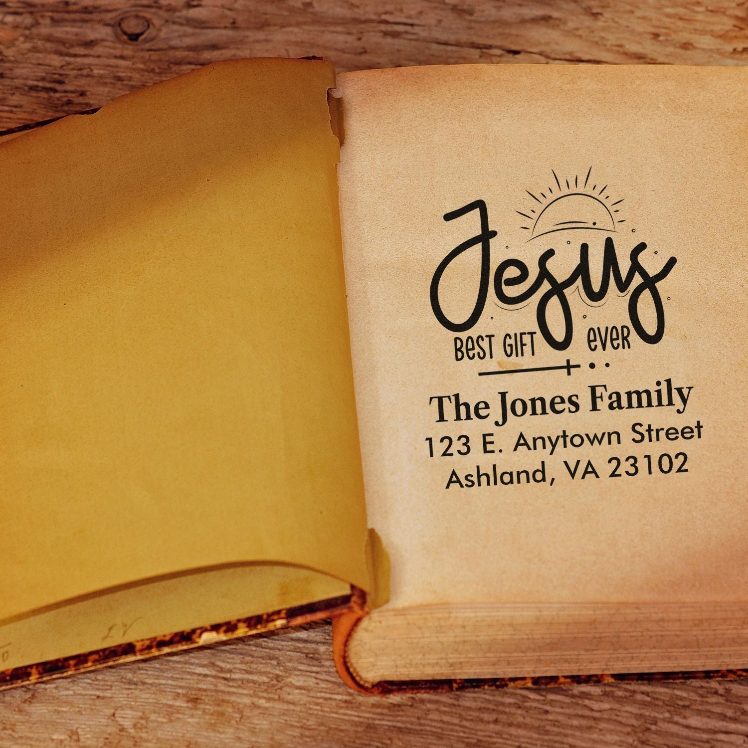 Custom Christian rubber stamp reading Jesus best gift ever with family name and address for personalized books.