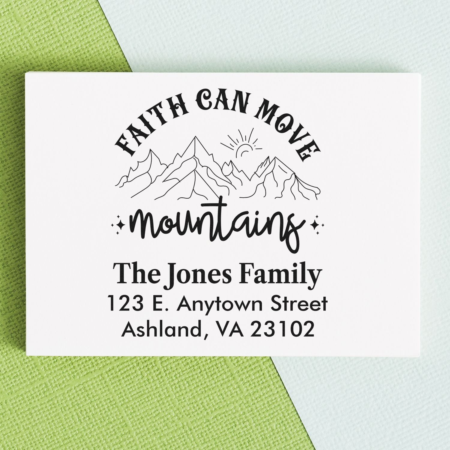 Custom faith can move mountains rubber stamp with mountains, family name, and address for personalized mailings.