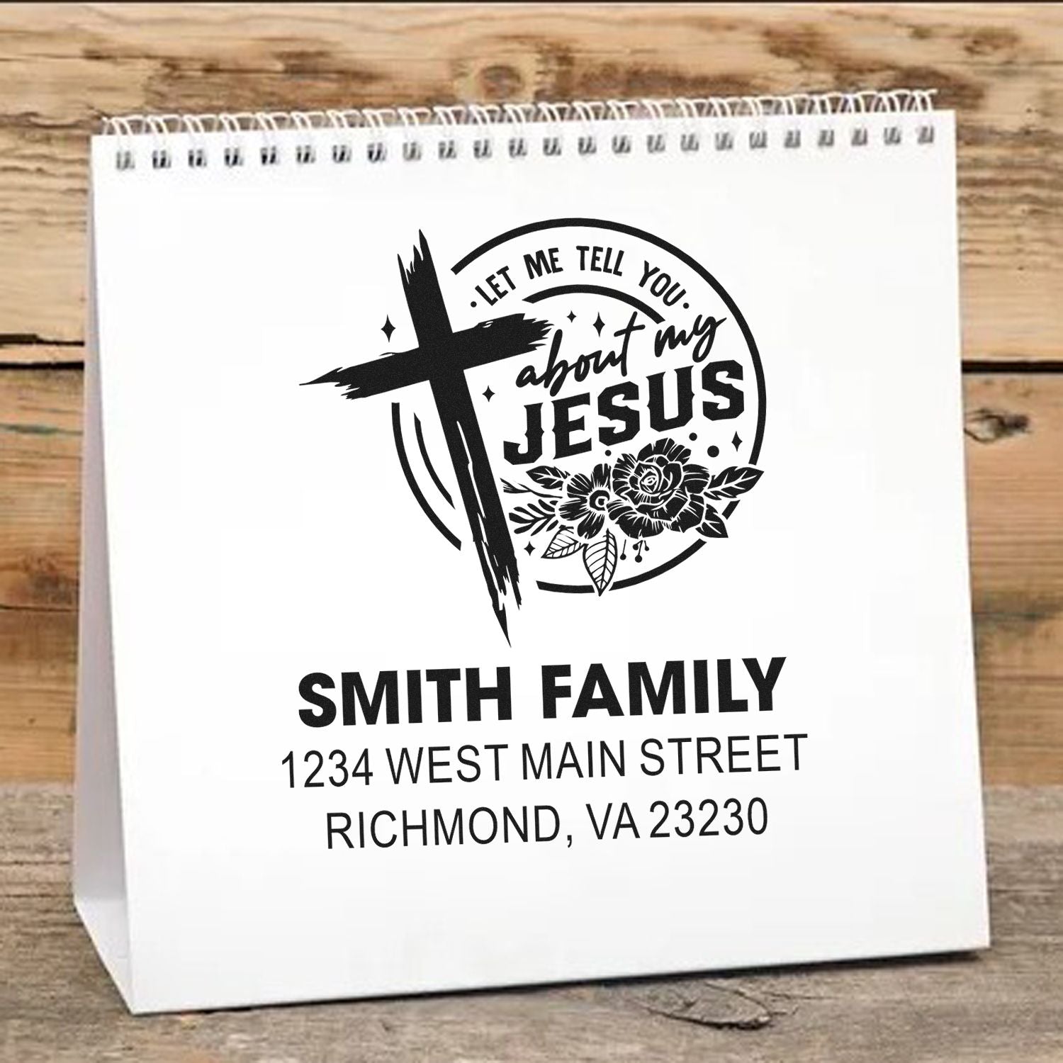 Custom Christian rubber stamp for gift bags, featuring Let me tell you about my Jesus with cross, flowers, family name, and address.