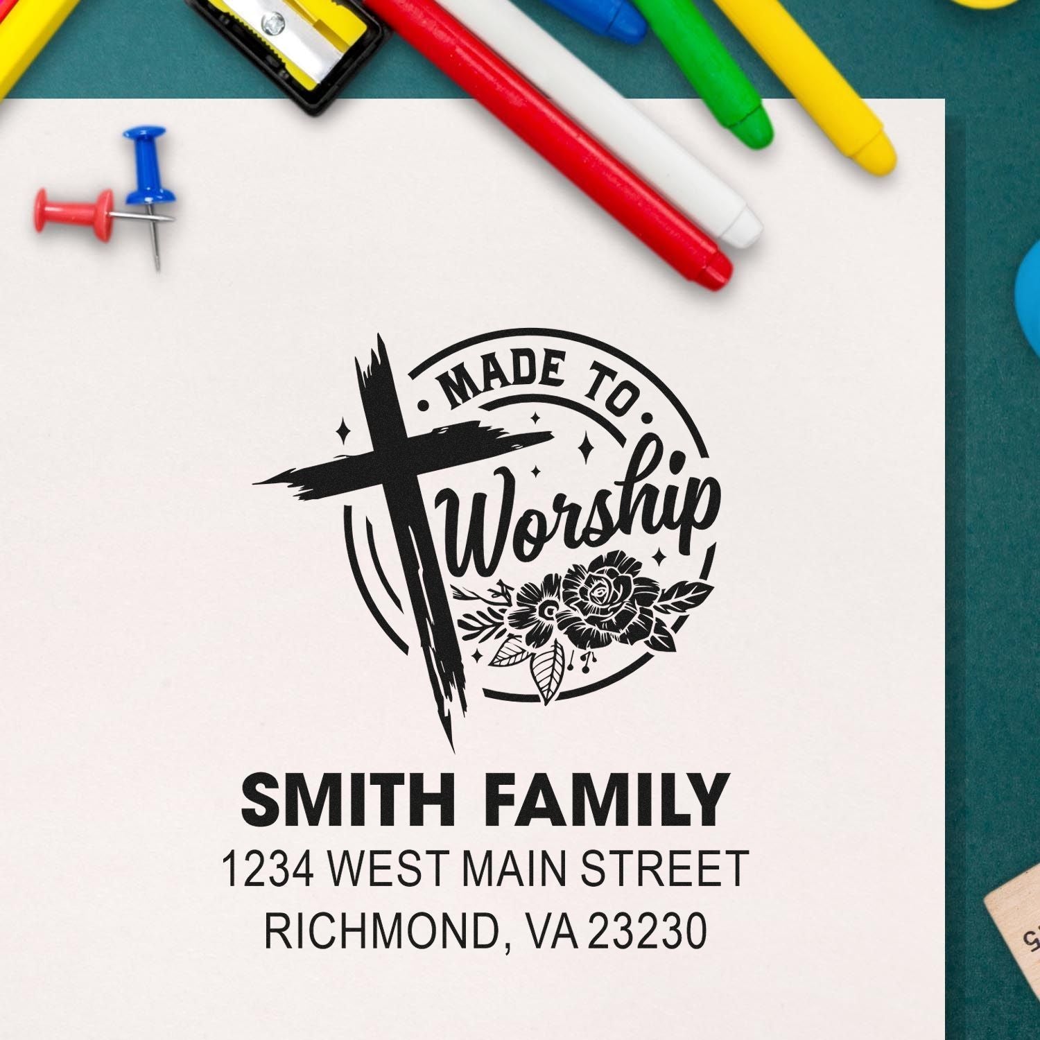 Custom rubber stamp mockup for Christian family stationery, featuring Made to Worship cross design, name, and return address.
