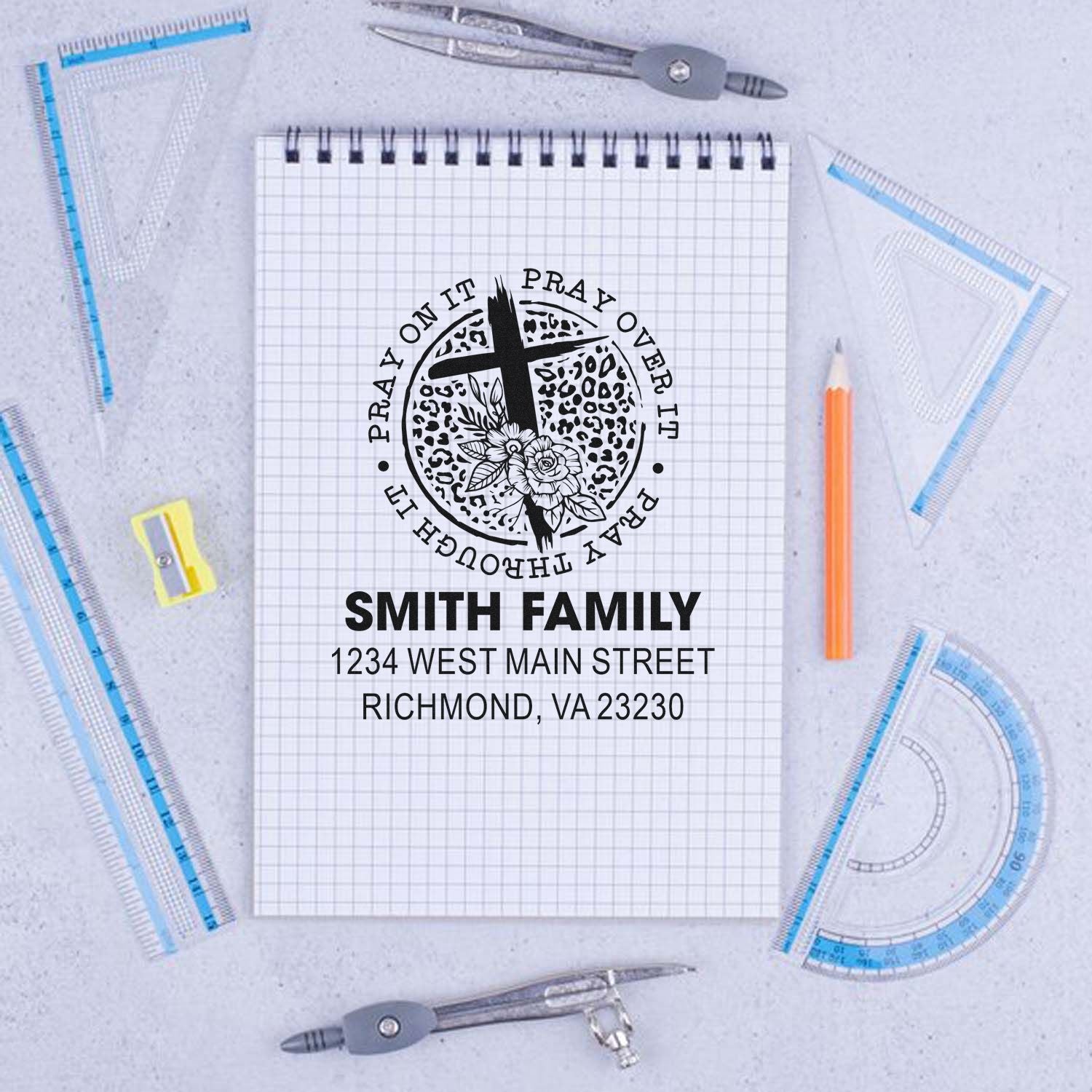 Personalized Christian family address rubber stamp with cross, floral emblem, and prayer message for stationery.