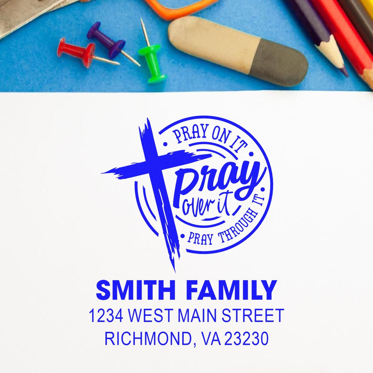 Custom rubber stamp design with prayer quote, blue cross, and Smith Family address for personalized church stationery.