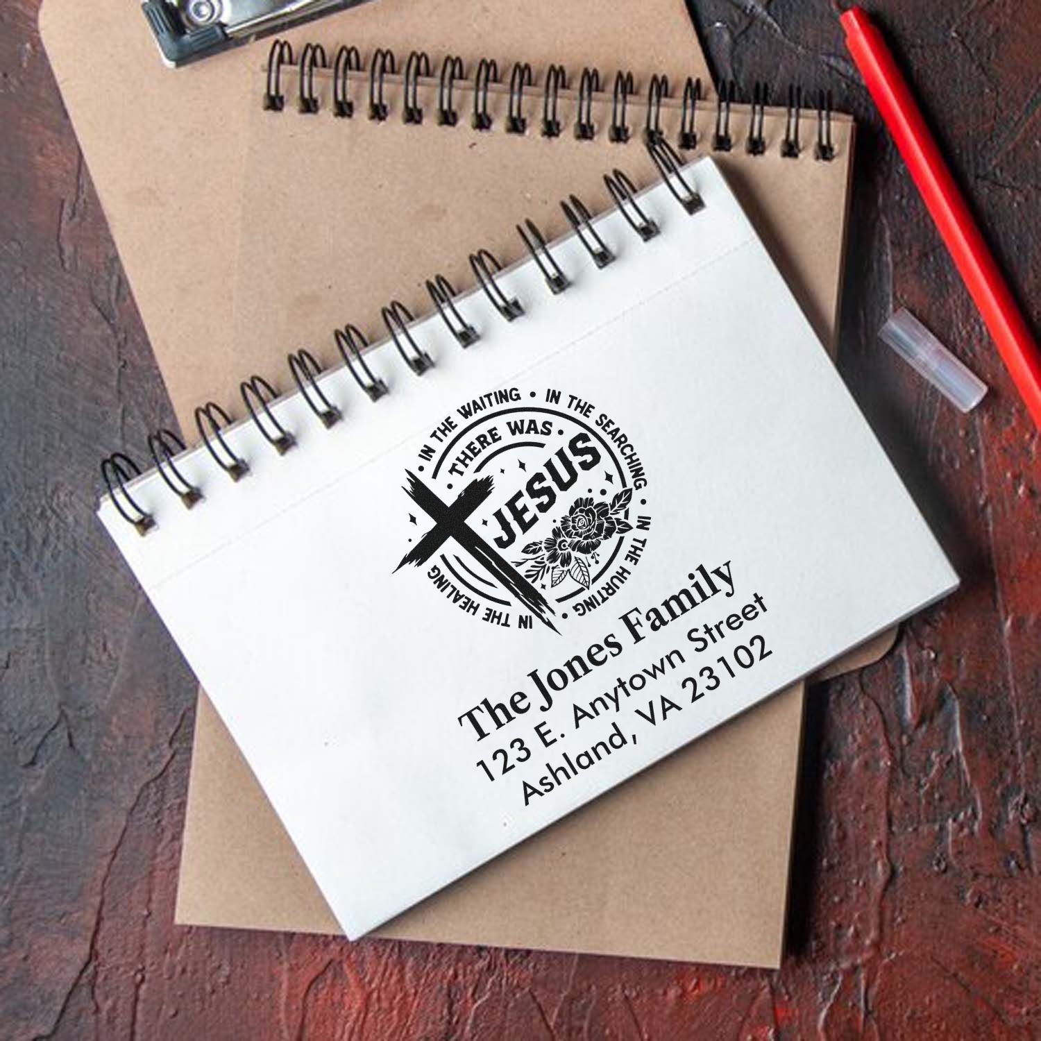 Custom Christian rubber stamp with Jesus cross design, family name, and address for personalized stationery and gifts.