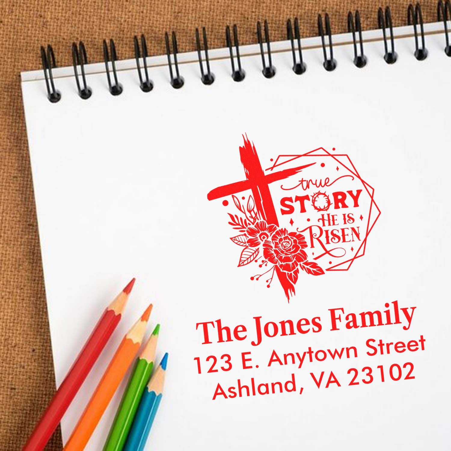 Custom Easter rubber stamp with cross and floral He Is Risen design, personalized with family name and address.