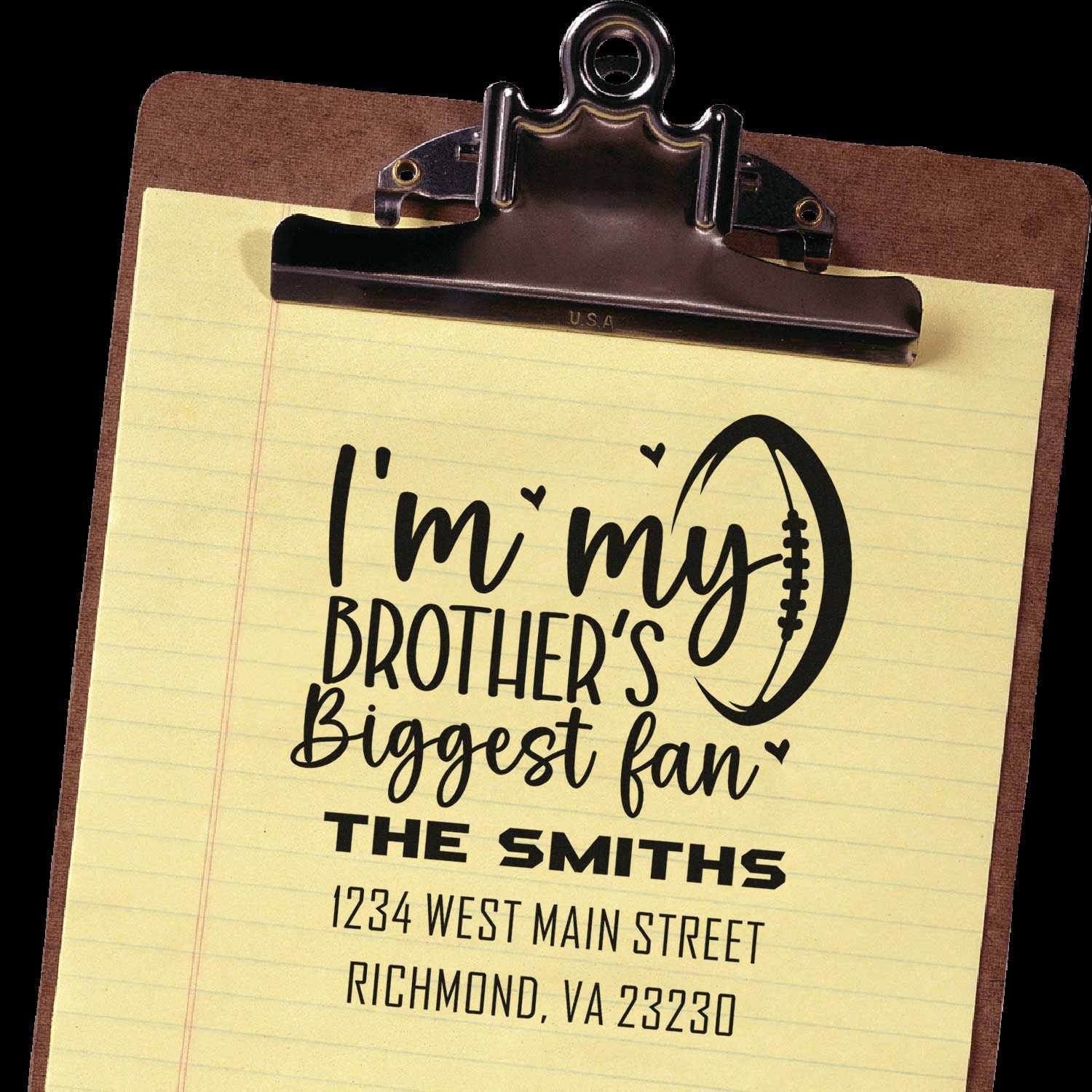 Personalized rubber stamp mockup with football fan message: Im my brothers biggest fan, plus name and address.