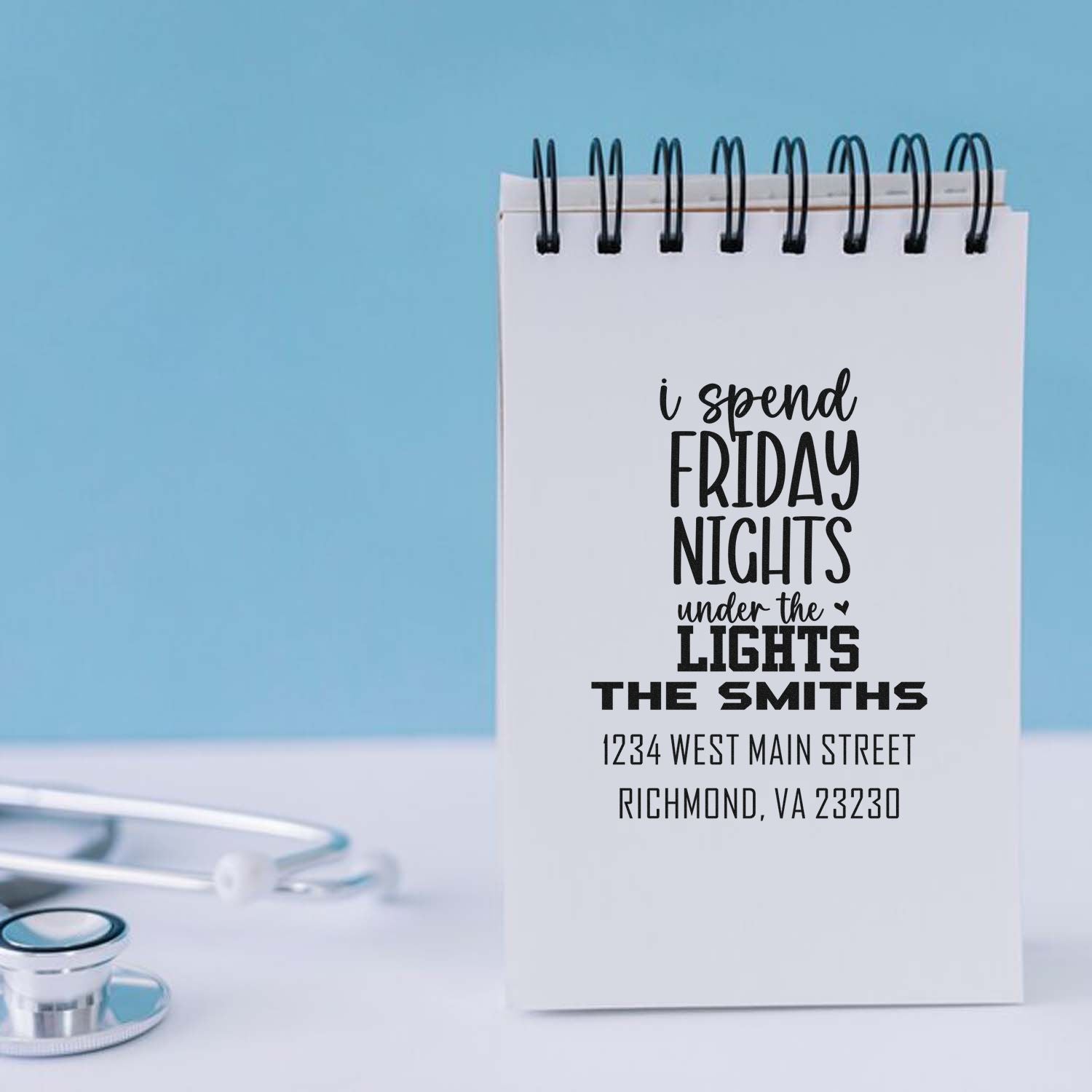 Personalized rubber stamp design for a medical professional with custom quote, name, and address.