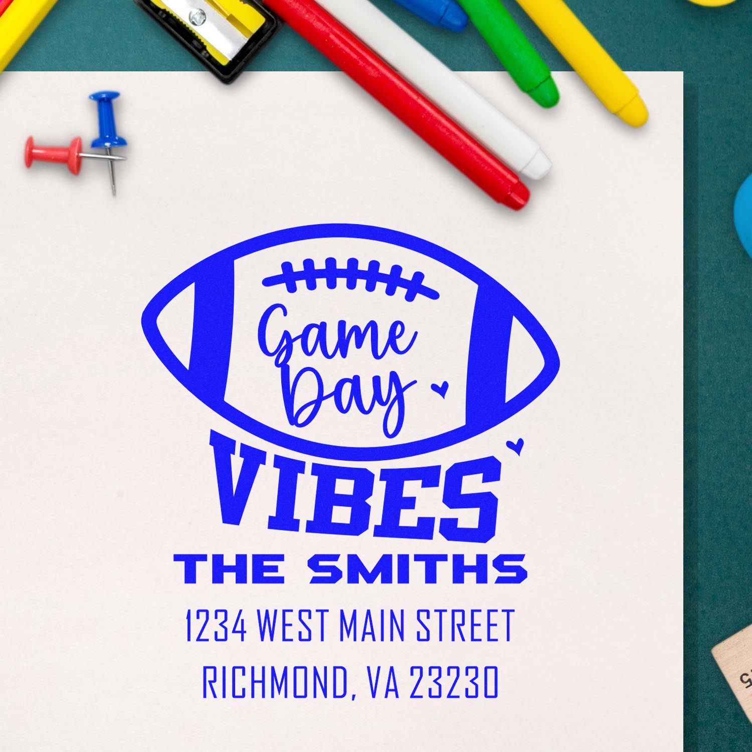 Custom rubber stamp design with football graphic, Game Day Vibes, and family address for game-day stationery.