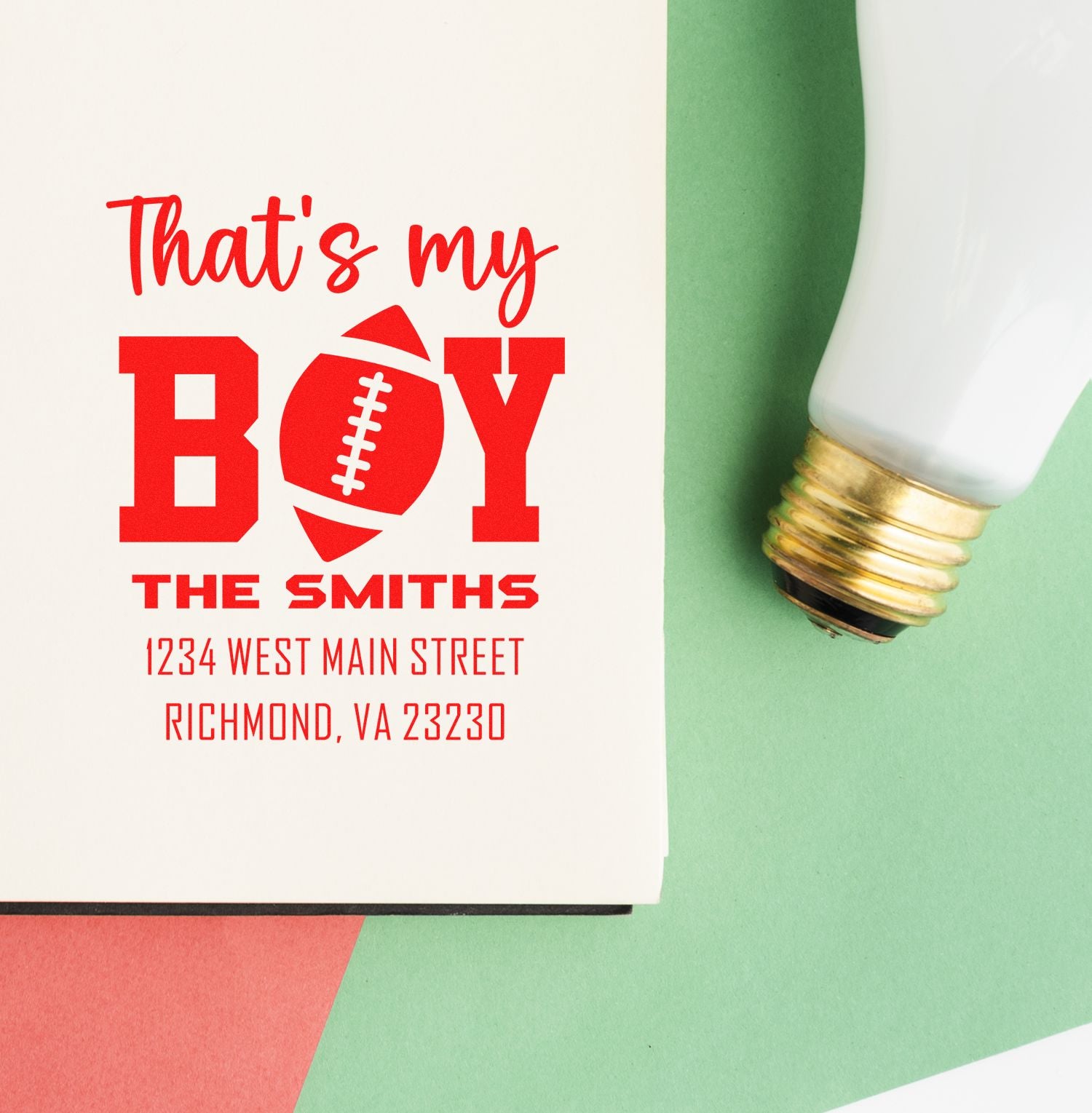 Custom football-themed rubber stamp design reading Thats my Boy with family name and return address for personalized stationery.