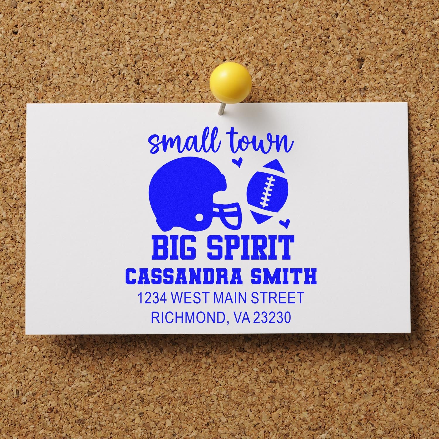 Personalized football-themed rubber stamp with Small Town Big Spirit design and custom return address for Cassandra Smith.