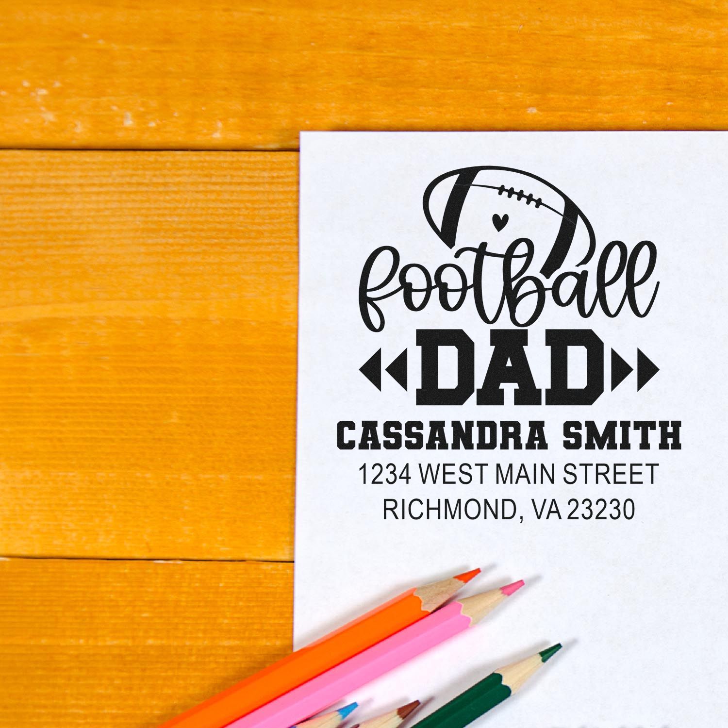 Personalized football dad rubber stamp with name and address, ideal for custom return labels and sporty gift stationery.