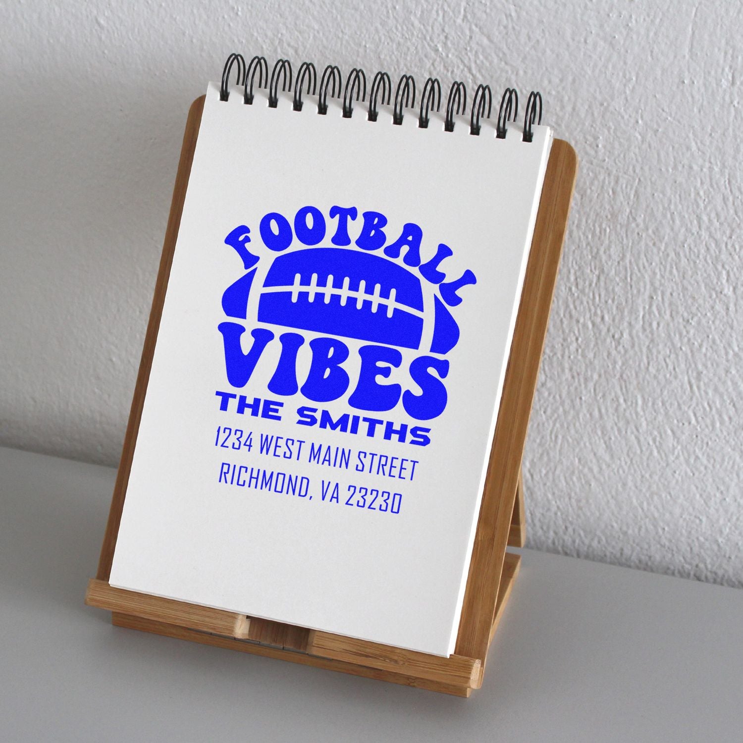 Custom football address rubber stamp with family name and address, ideal for personalized mail, stationery, and fan gifts.