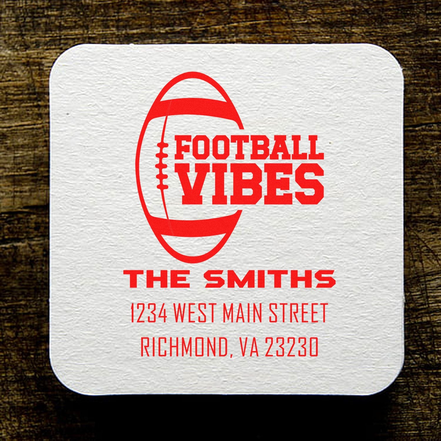 Custom football vibes rubber stamp with family name and address for sports-themed personalized mailing.