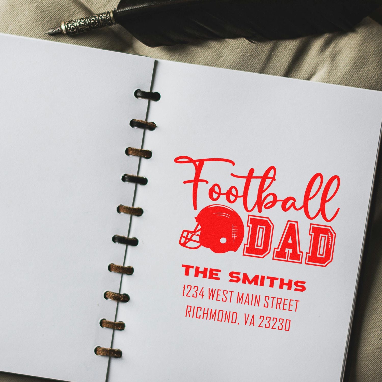 Personalized football dad rubber stamp with family name and address, perfect for custom sports-themed stationery and gifts.