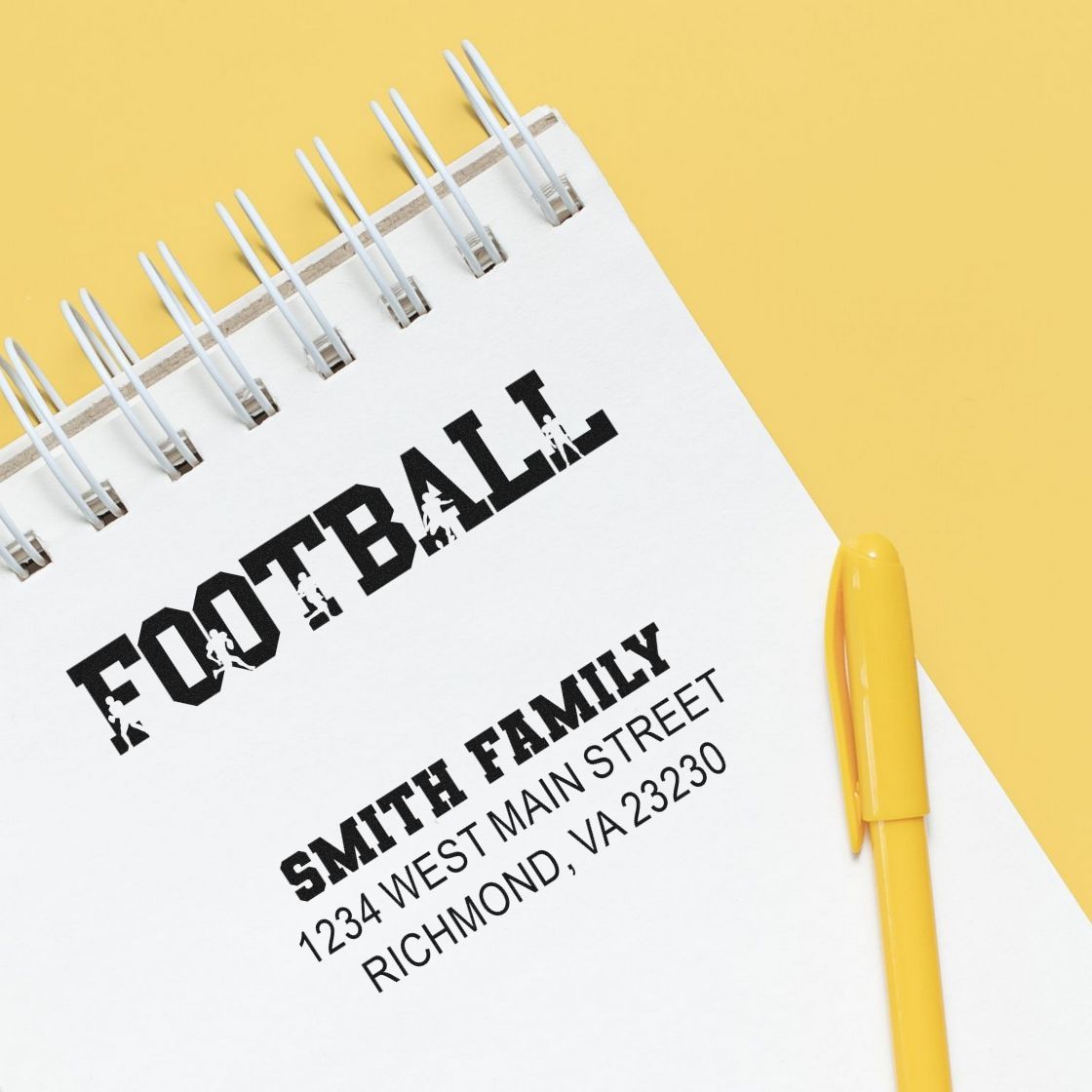 Personalized football rubber stamp with family name and address, ideal for custom sports-themed stationery and gifts.