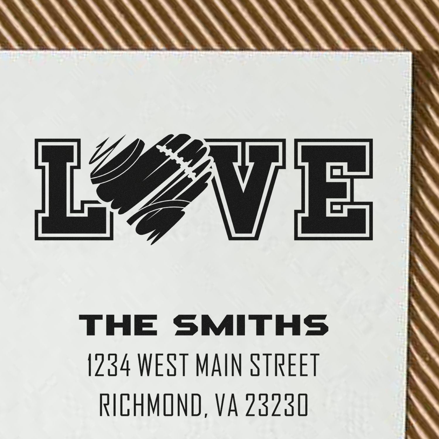 Custom rubber stamp design with LOVE and football graphic for The Smiths, featuring address 1234 West Main Street, Richmond, VA 23230.