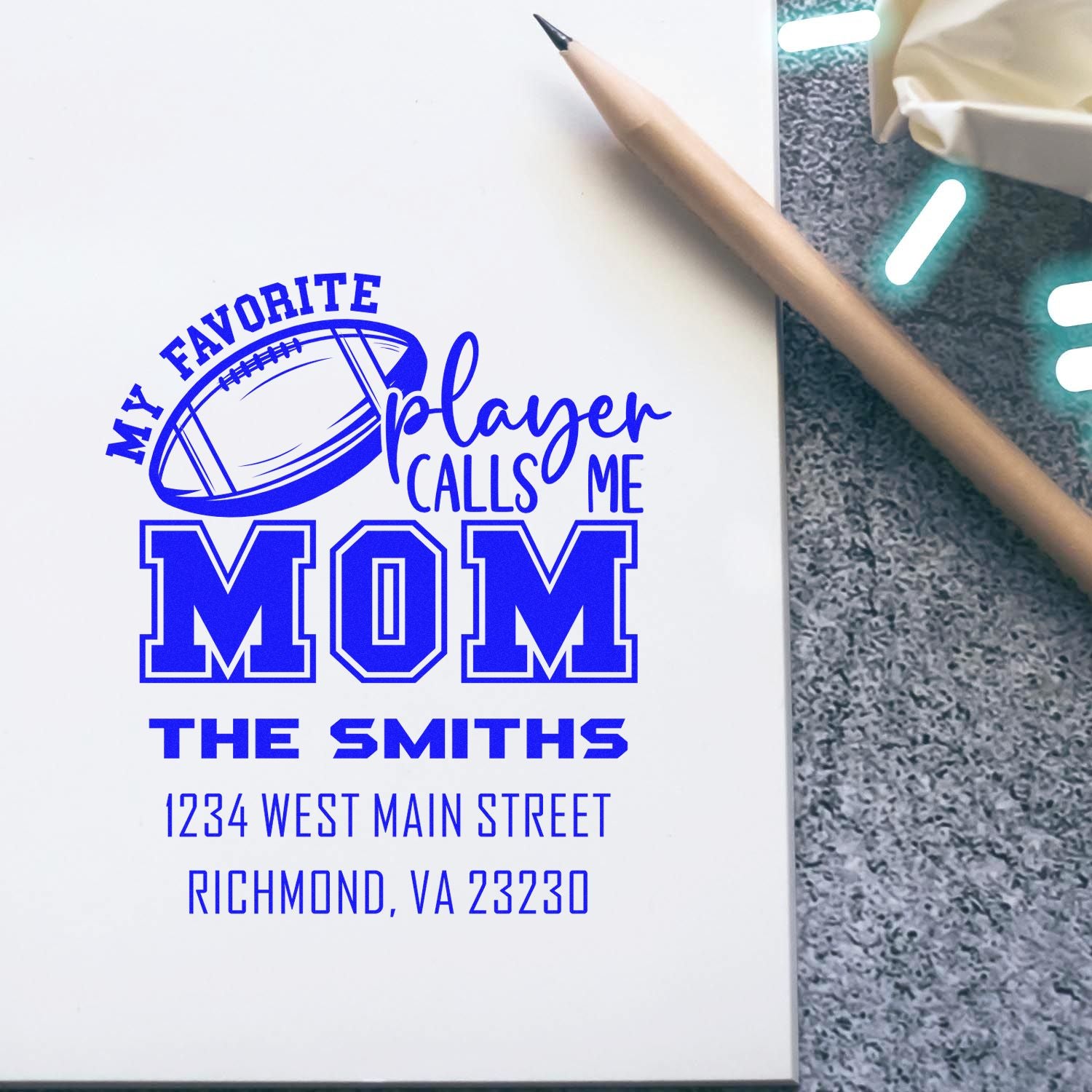 Custom rubber stamp design for a football mom, reading My Favorite Player Calls Me Mom with family name and address.