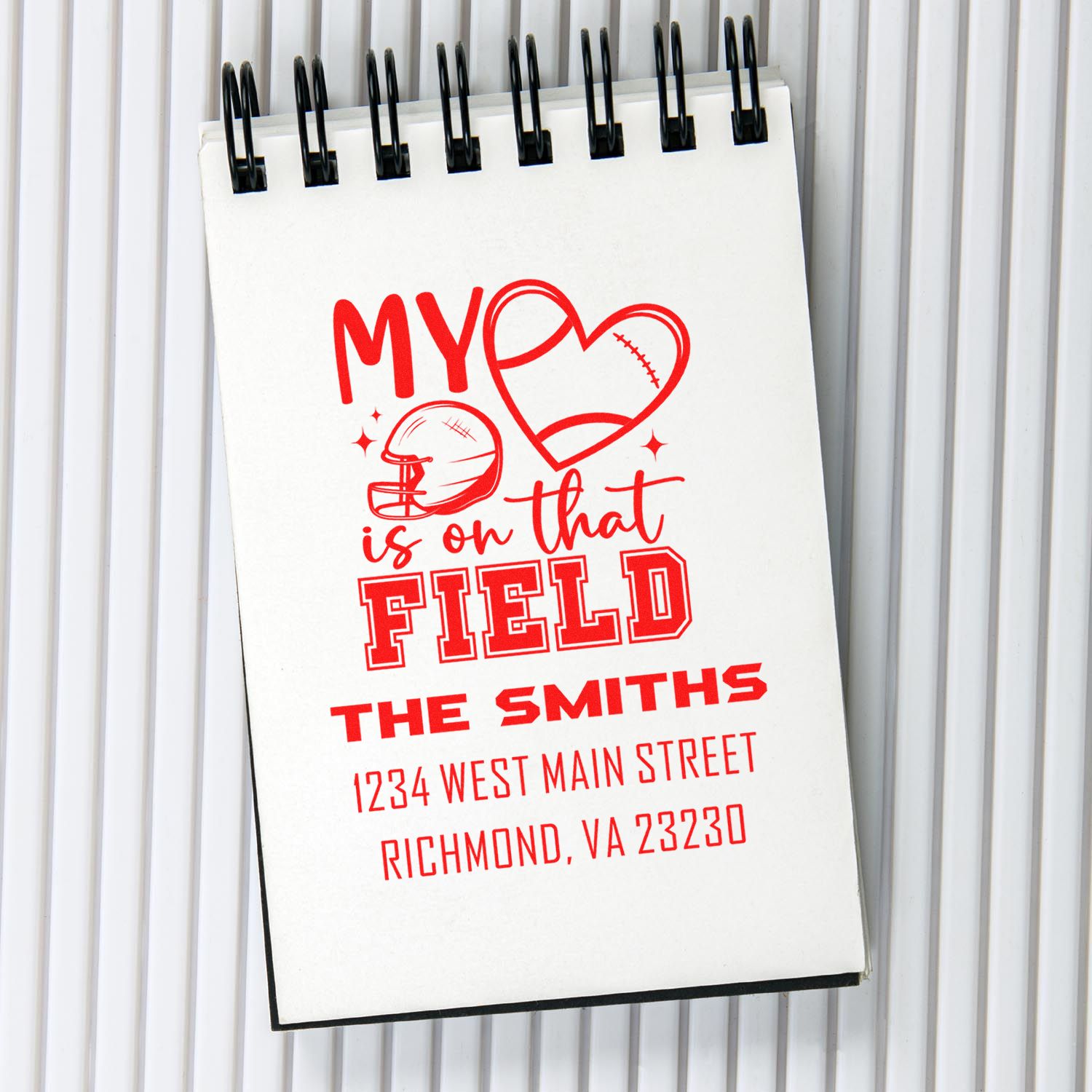 Custom rubber stamp with football-themed My heart is on that field family name and address for personalized stationery.