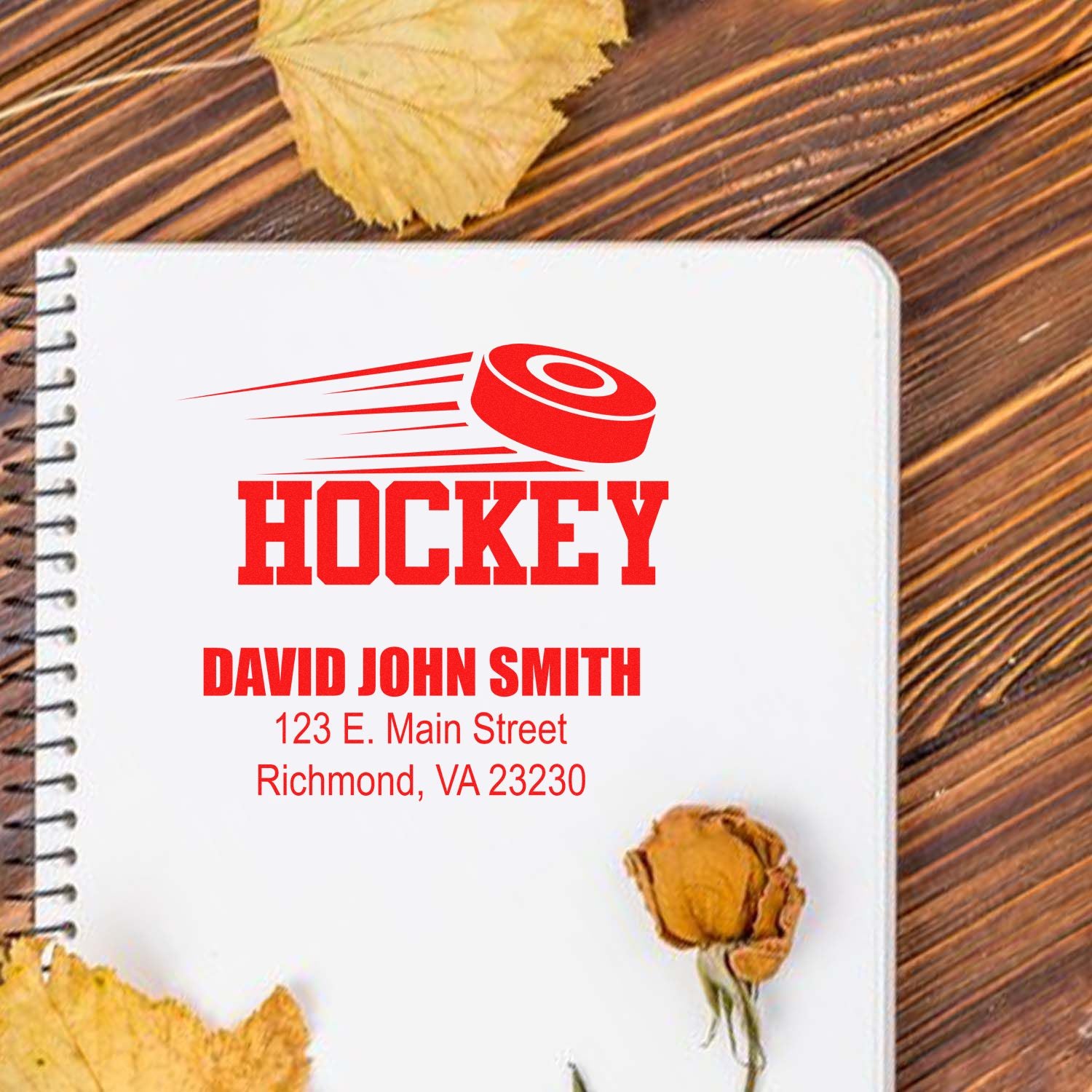 Custom hockey rubber stamp with puck graphic, personalized name and address for notebooks, sports gifts, and fan stationery.