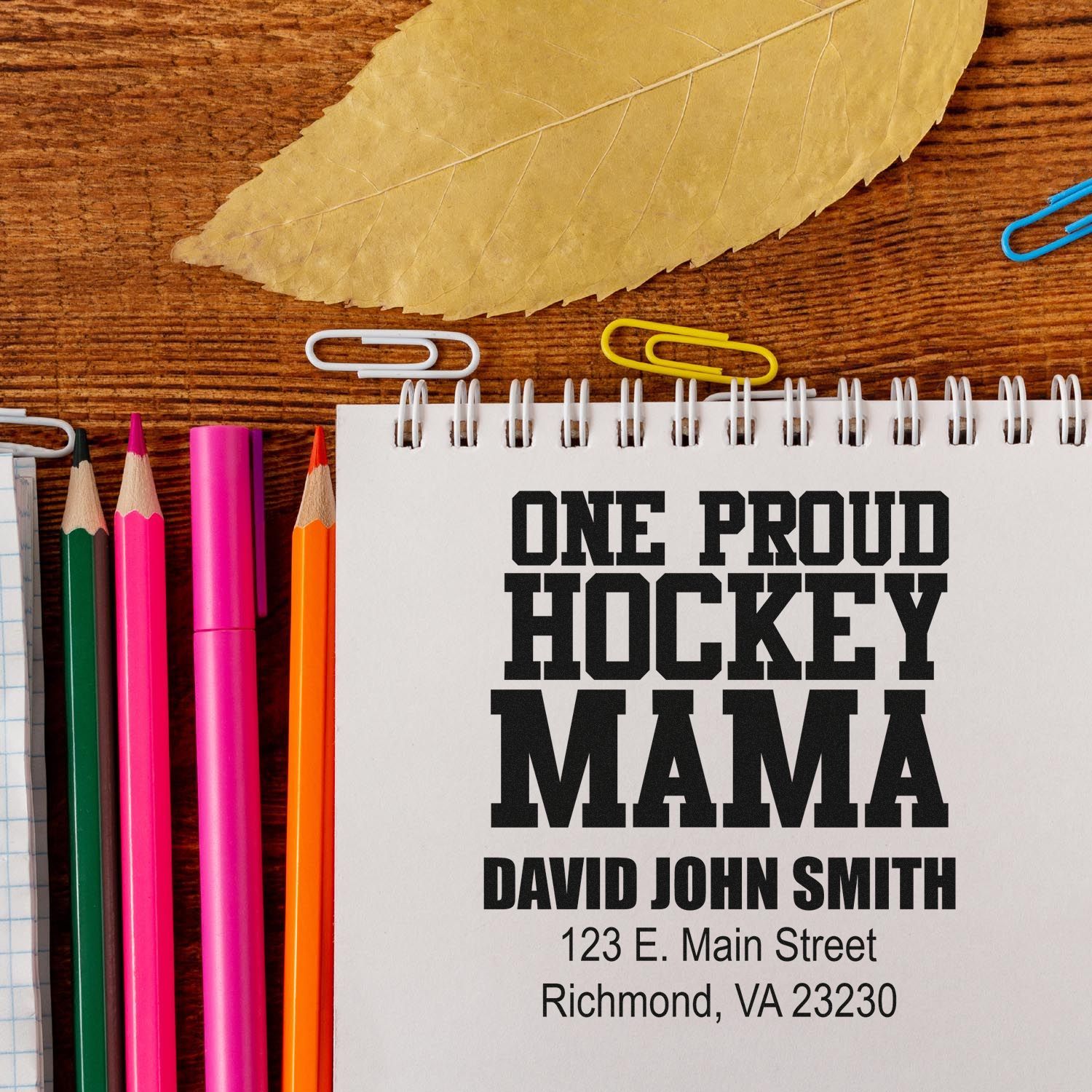 Custom rubber stamp mockup for a proud hockey mama, with personalized name and address for stationery.