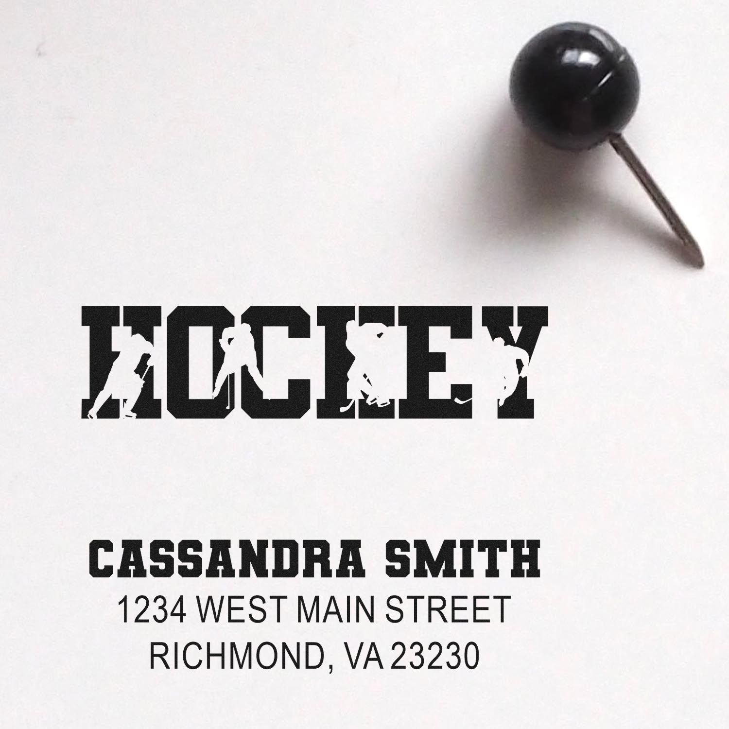 Custom hockey rubber stamp proof with name and address, featuring hockey player silhouettes for personalized mail.