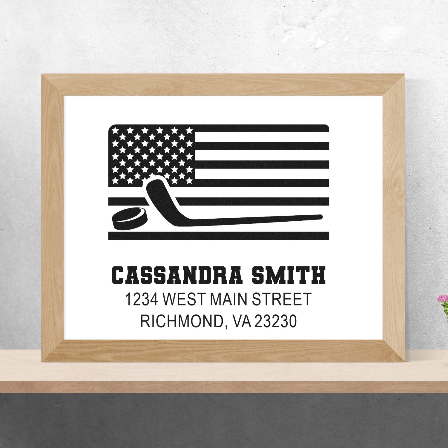 Personalized hockey return address rubber stamp with American flag, puck and stick, featuring custom name and address.