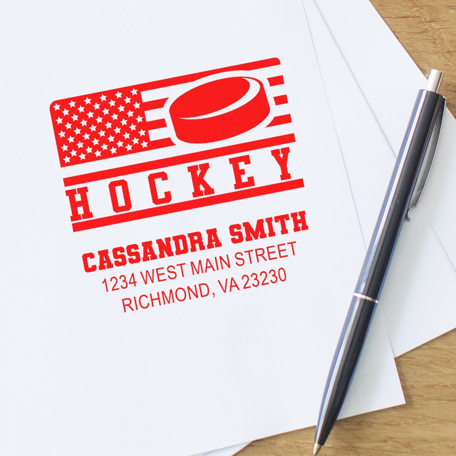 Custom hockey rubber stamp with American flag logo, name and address for personalized team branding.