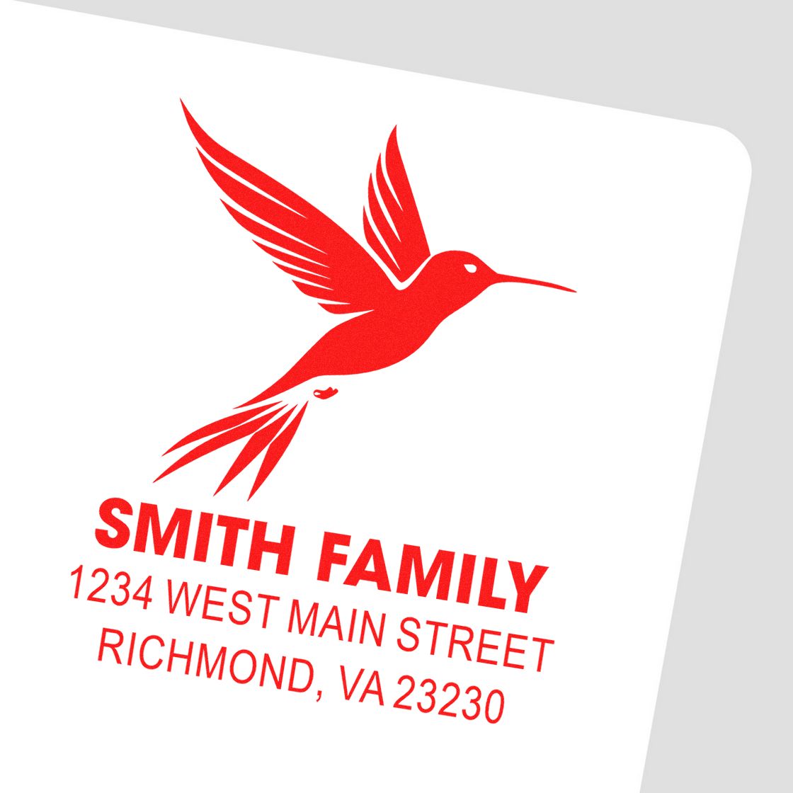 Custom red hummingbird return address rubber stamp with Smith Family name and Richmond, VA mailing address.