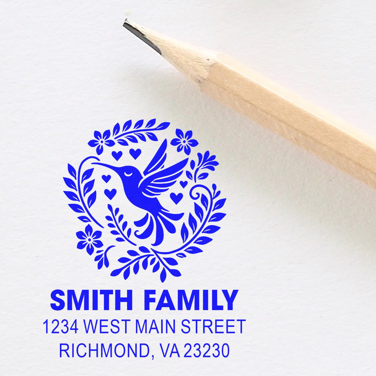 Custom rubber address stamp with hummingbird floral heart design for Smith Family mailing and branding.
