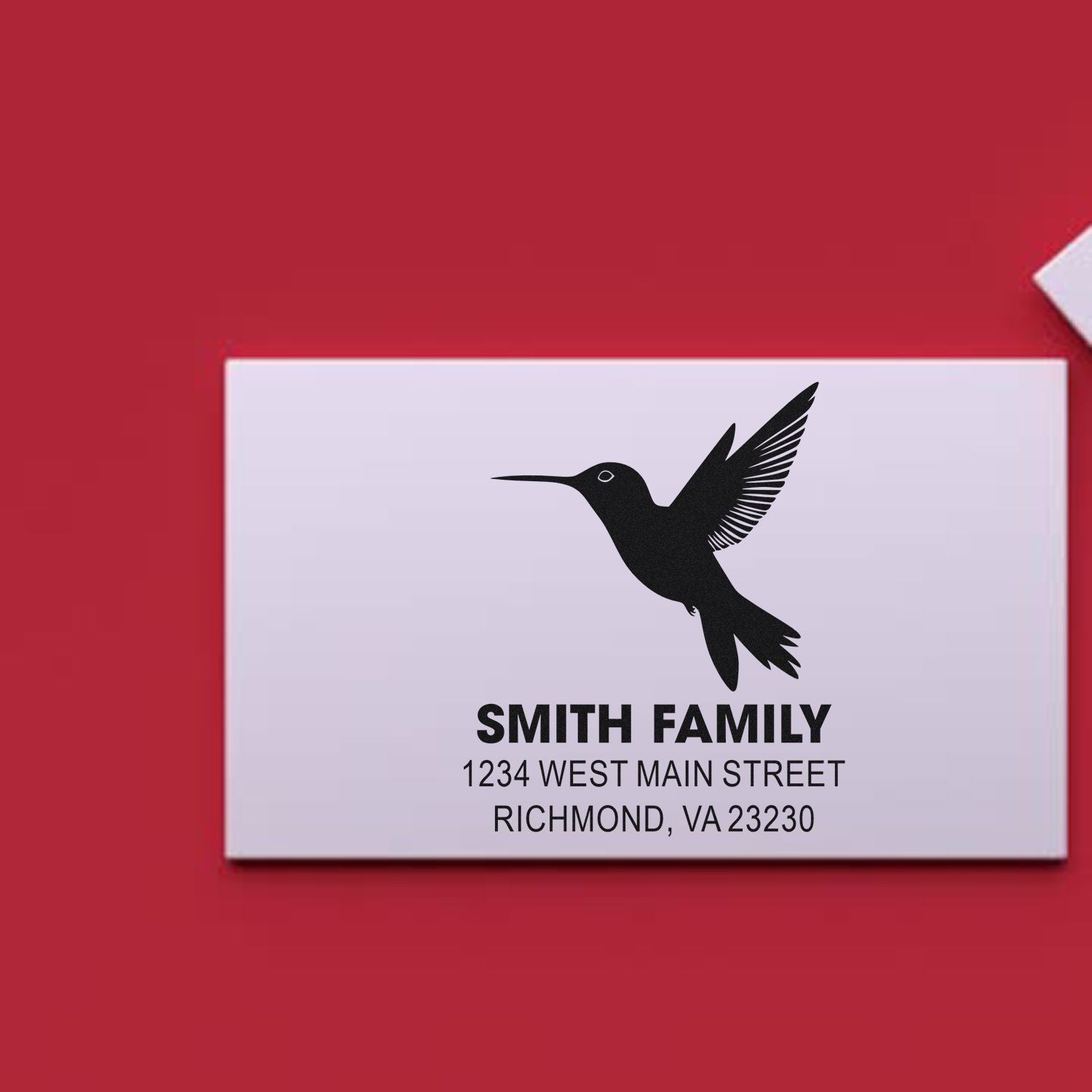 Personalized return address rubber stamp with hummingbird logo for Smith Family, Richmond, VA.