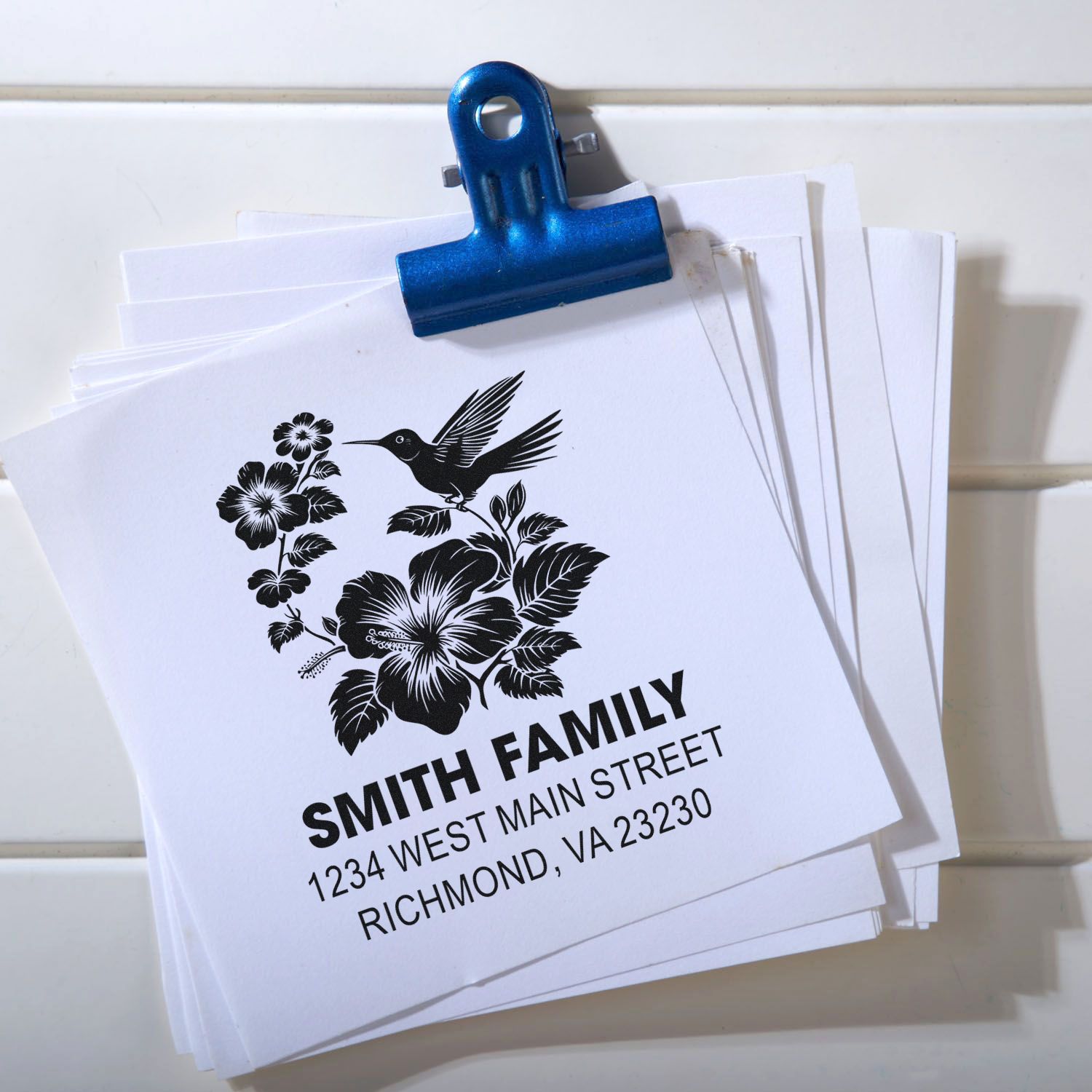 Custom family return address rubber stamp with floral hummingbird design for wedding invitations, mailings, and stationery.