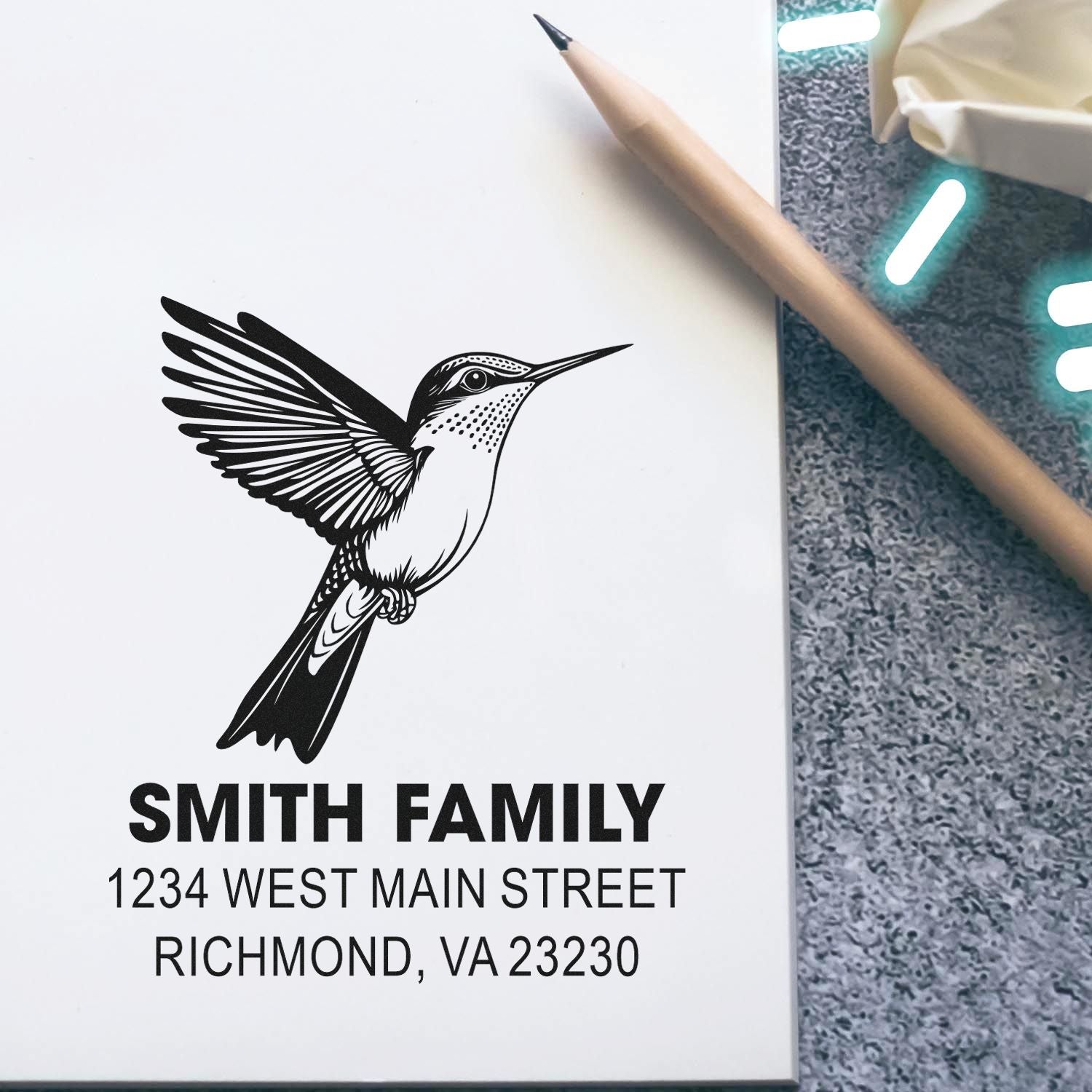 Custom hummingbird return address rubber stamp with Smith Family name and Richmond, VA 23230 address.