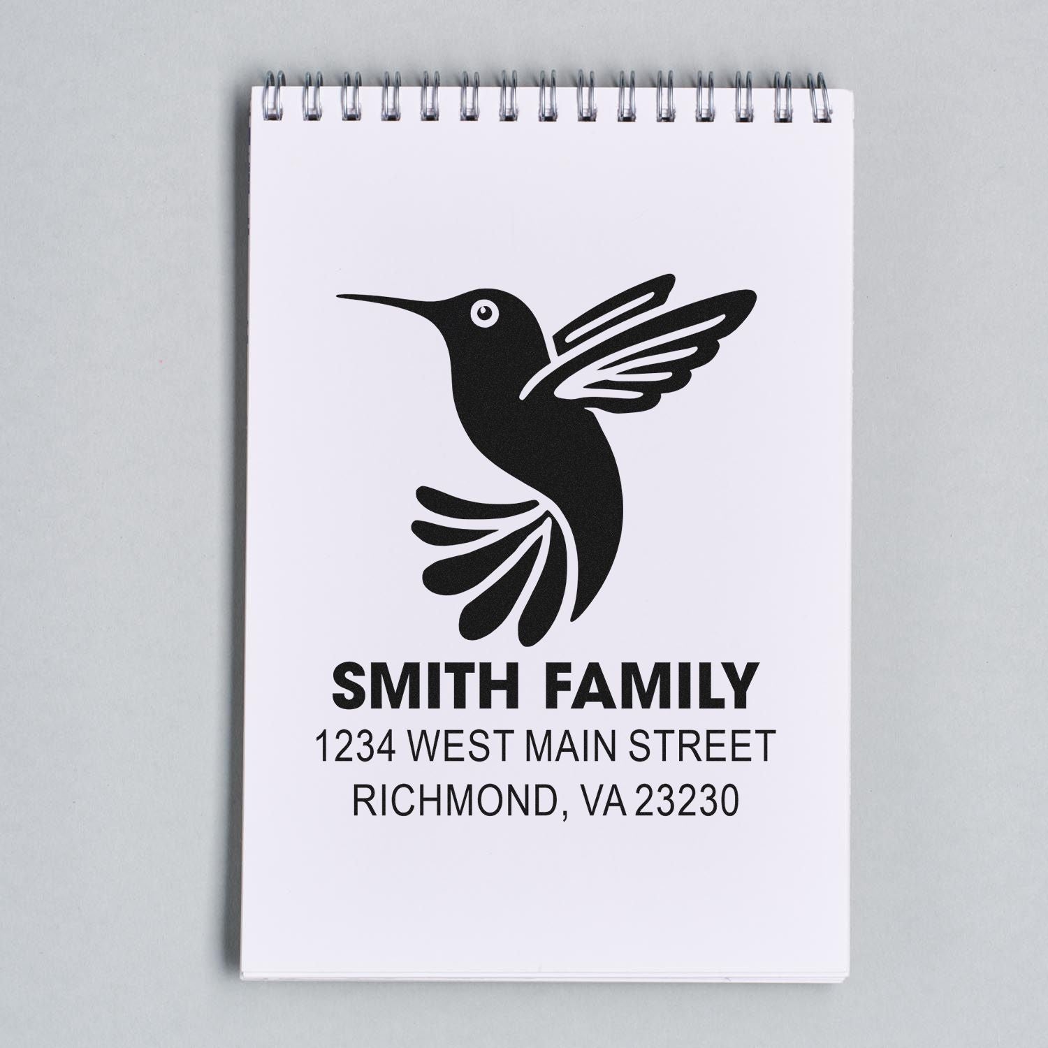 Personalized Smith Family return address rubber stamp with hummingbird logo for custom mail and stationery.