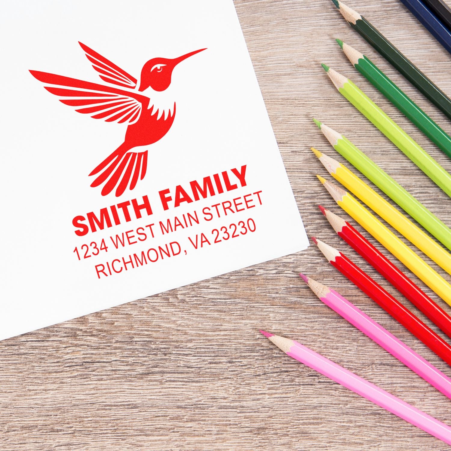 Custom hummingbird family return address rubber stamp with Smith name and Richmond, VA address on paper