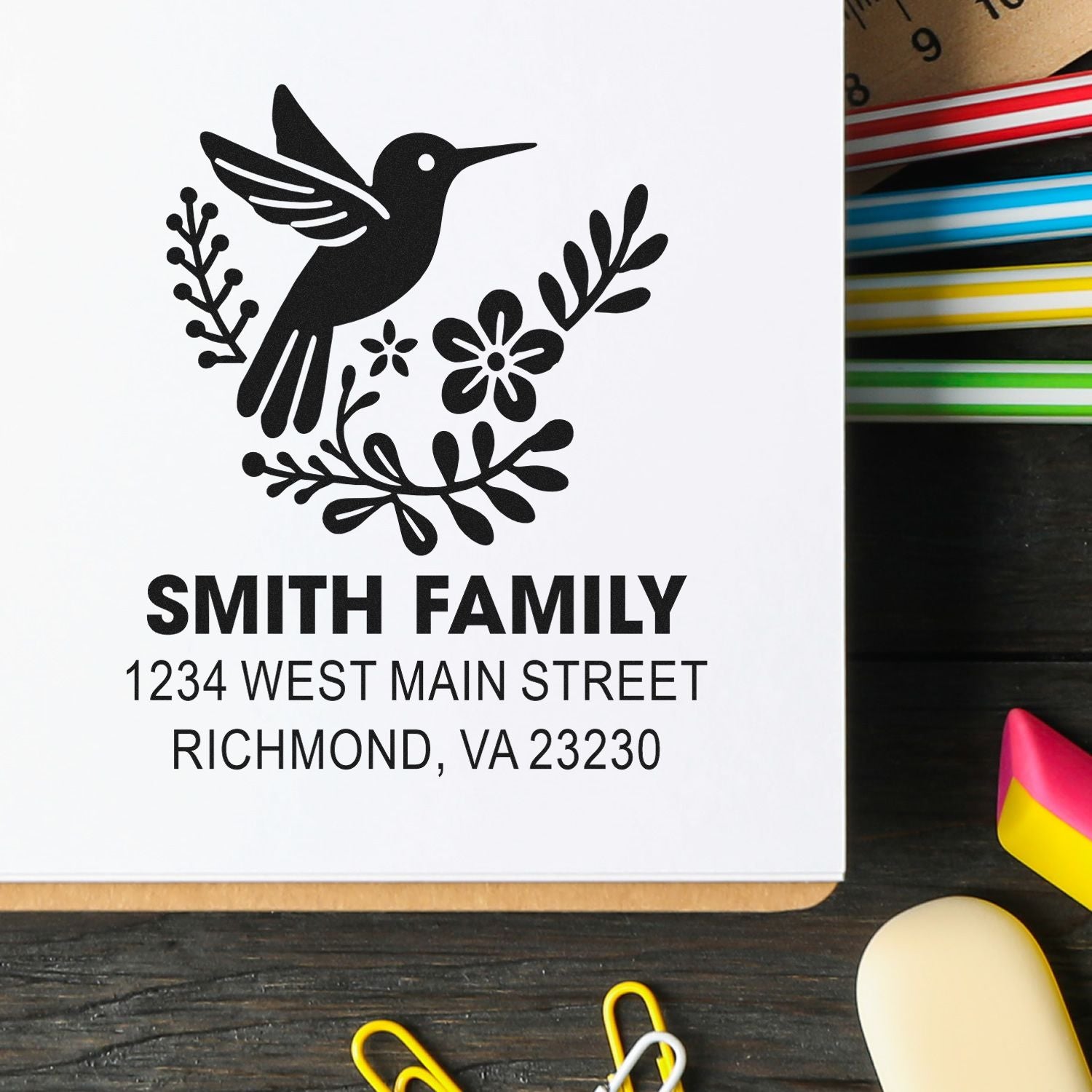 Custom return address rubber stamp with hummingbird floral design for Smith Family, Richmond, VA 23230.