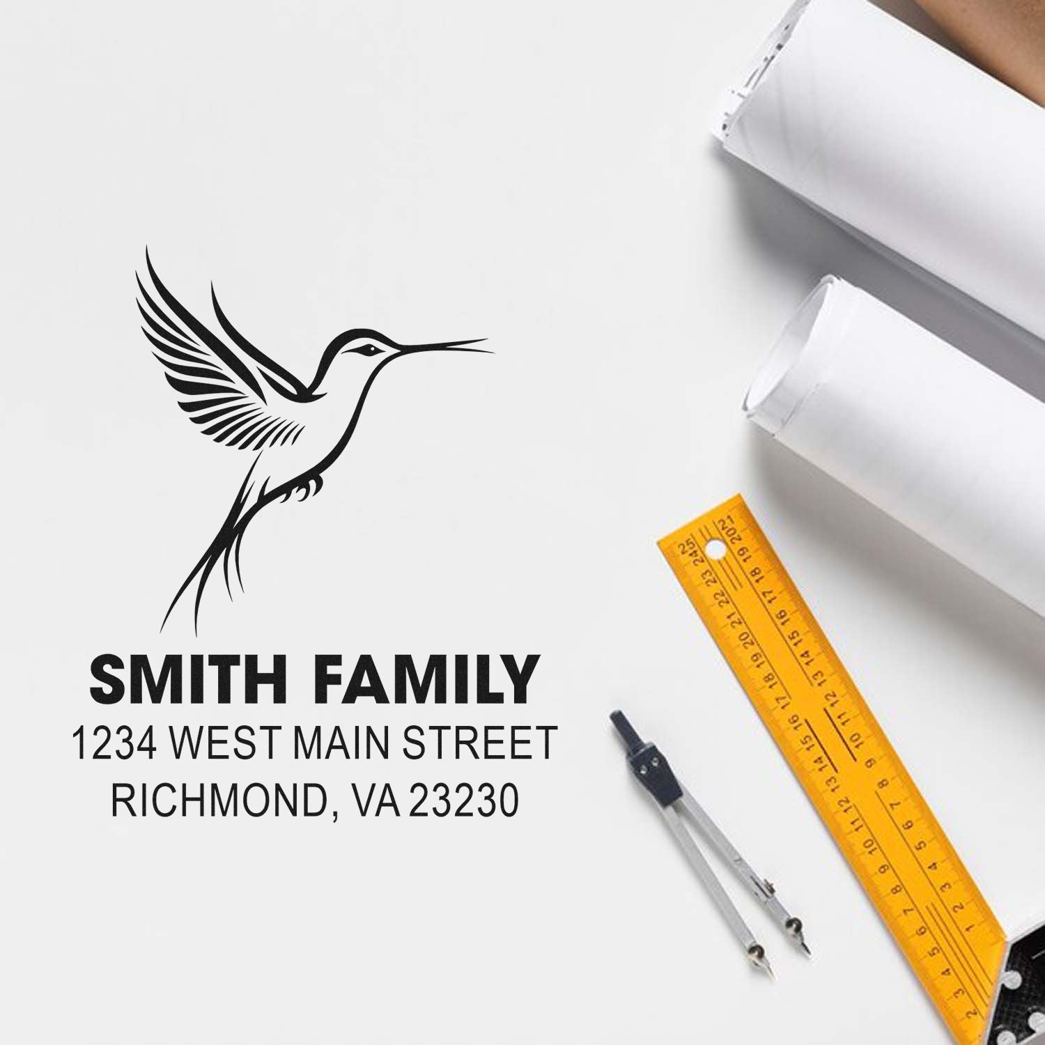 Custom rubber stamp mockup with hummingbird logo and Smith Family return address for personalized mailing.