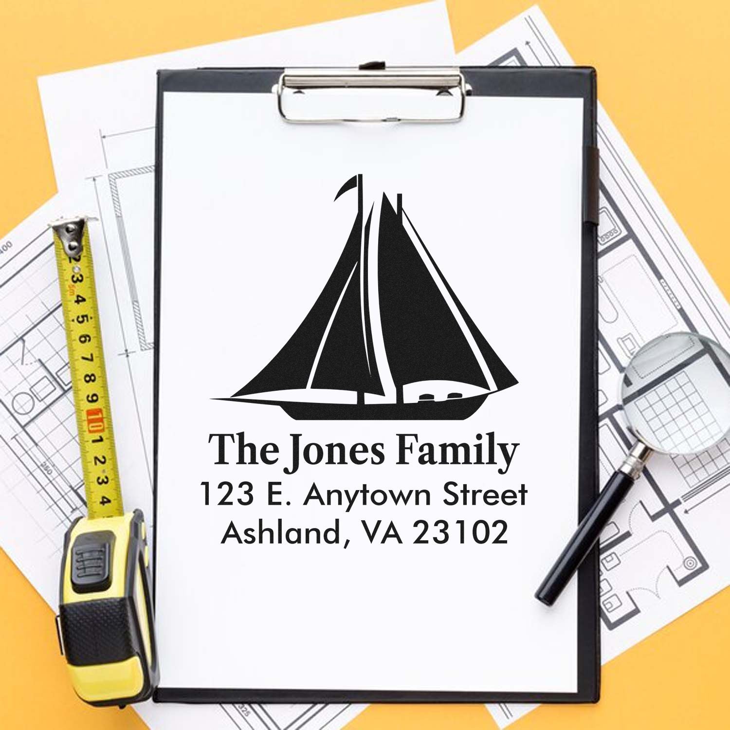 Custom rubber return address stamp with sailboat design, family name, and address for envelopes and correspondence.