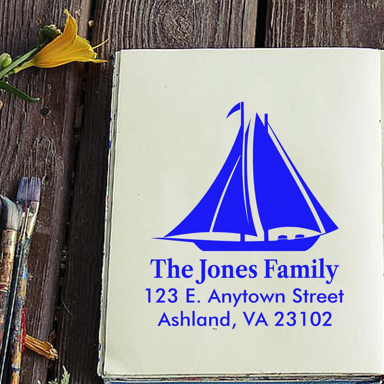 Personalized rubber stamp with sailboat logo, The Jones Family, and return address in Ashland, VA 23102.