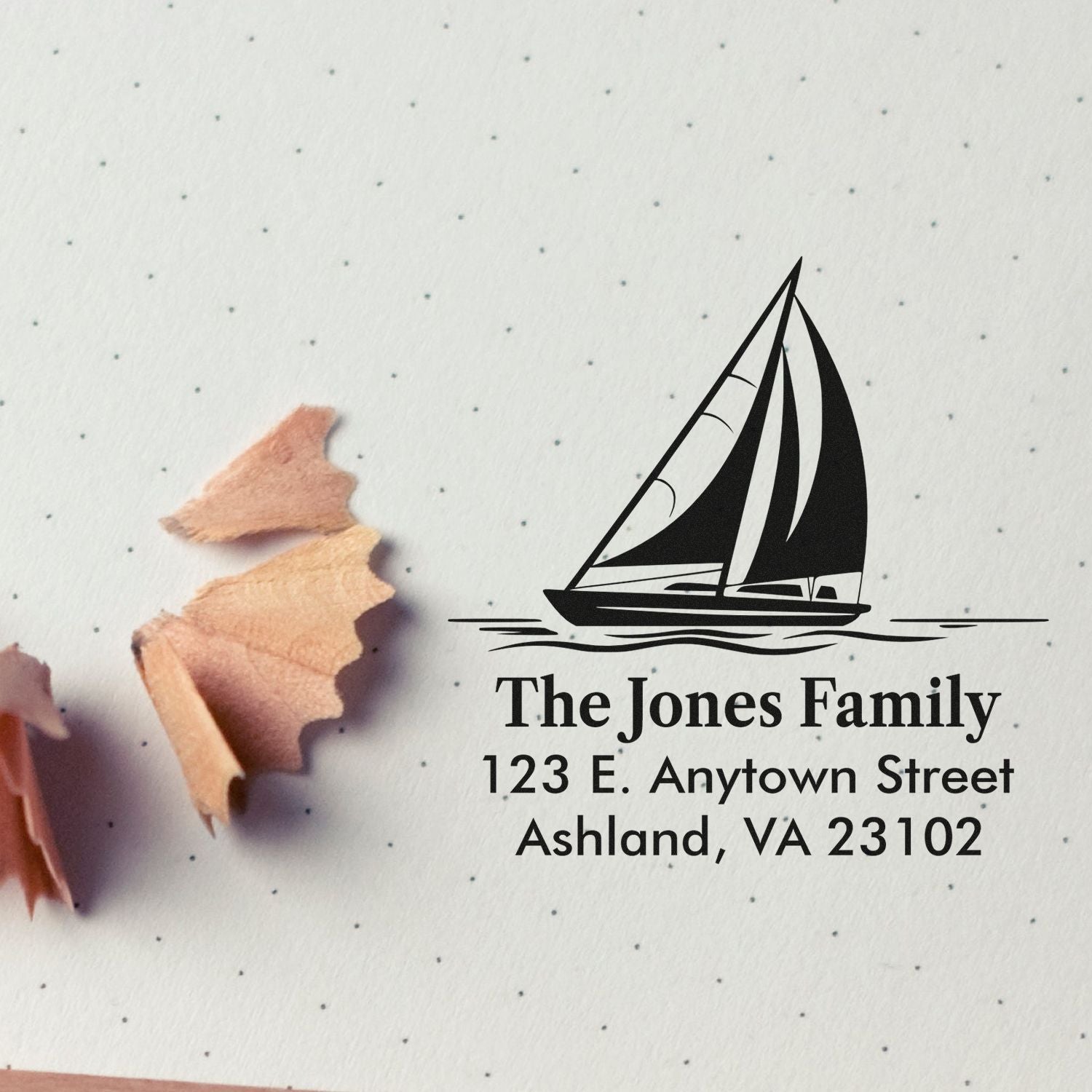 Custom sailboat return address rubber stamp for The Jones Family, 123 E. Anytown Street, Ashland, VA 23102.