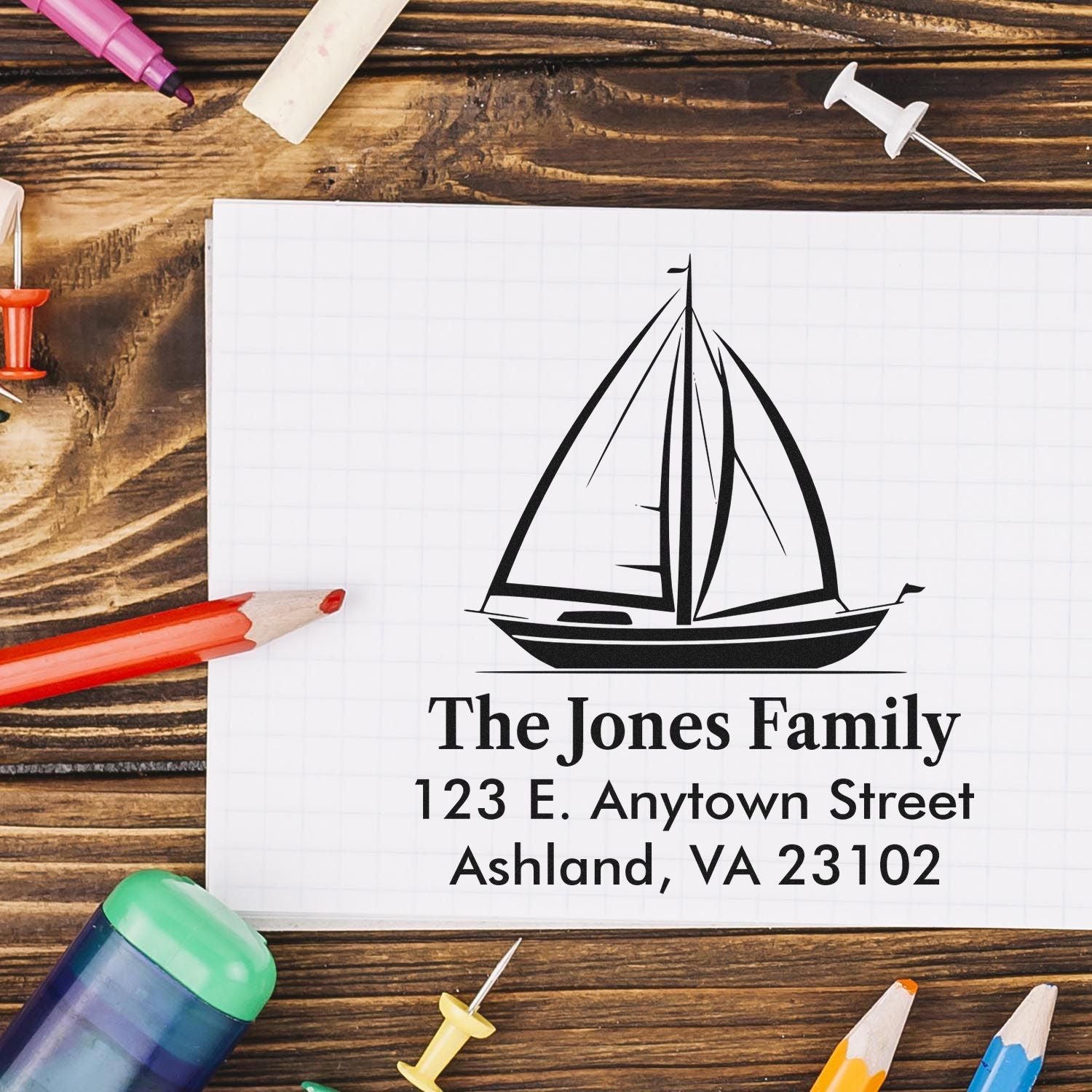 Custom sailboat return address rubber stamp for The Jones Family with personalized name and mailing address.