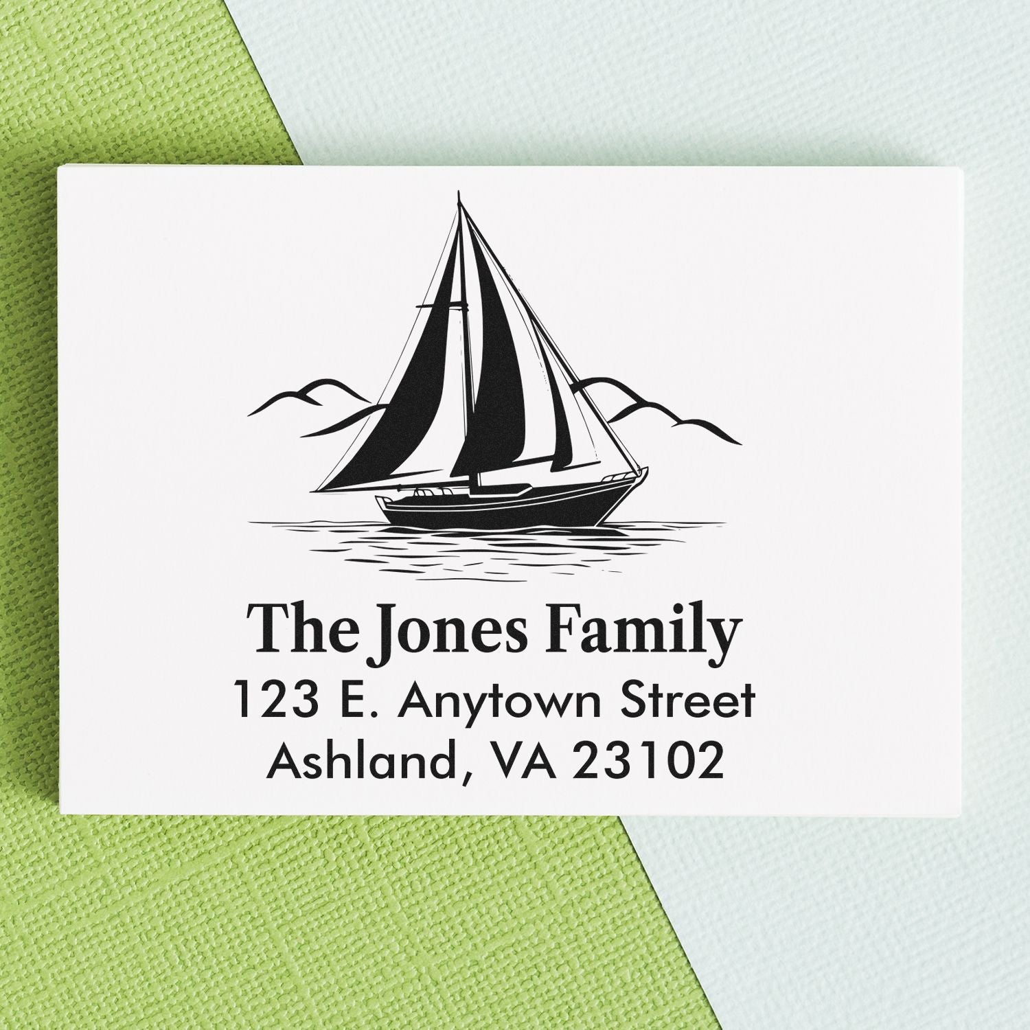 Personalized nautical address rubber stamp with sailboat design for custom family return addresses on envelopes.
